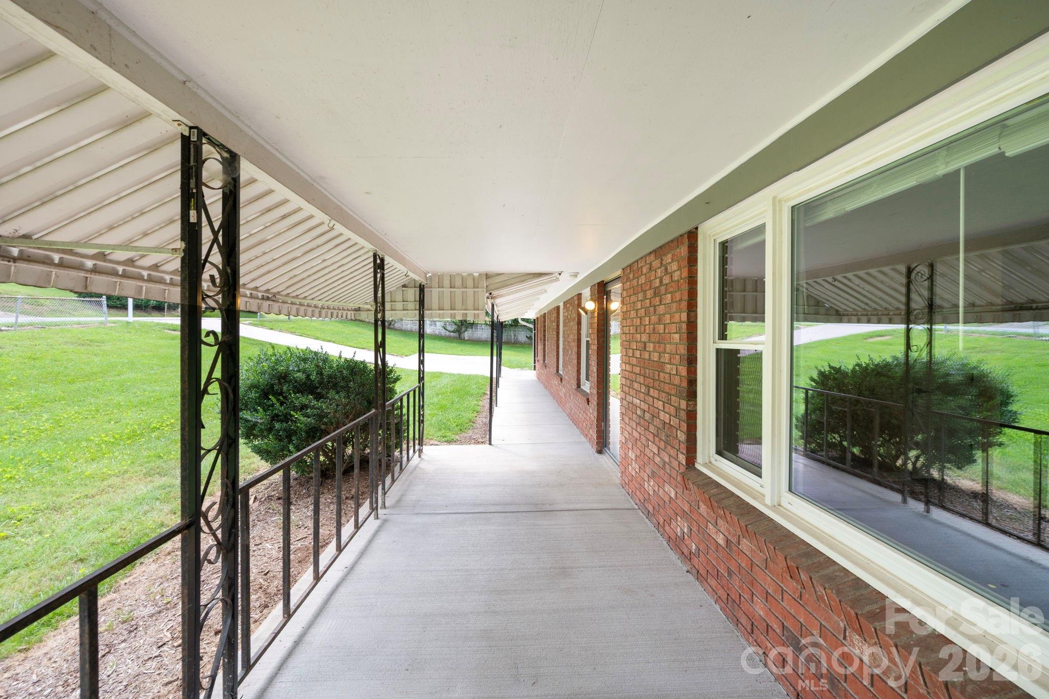 Covered walkway/porch from carport to front door - 483 Caribou Road, Asheville