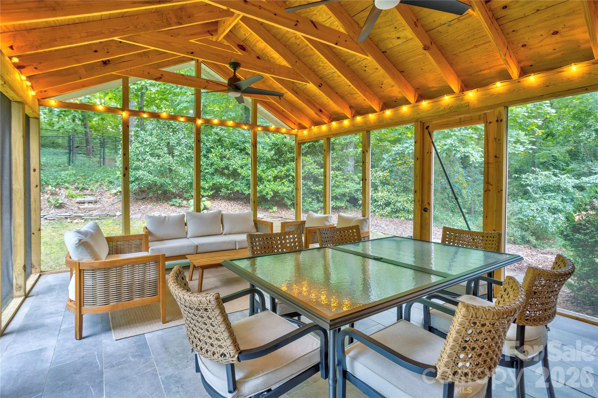 Entertain on the screened in back porch, with room for multiple seating areas. - 215 Bethel Drive, Salisbury