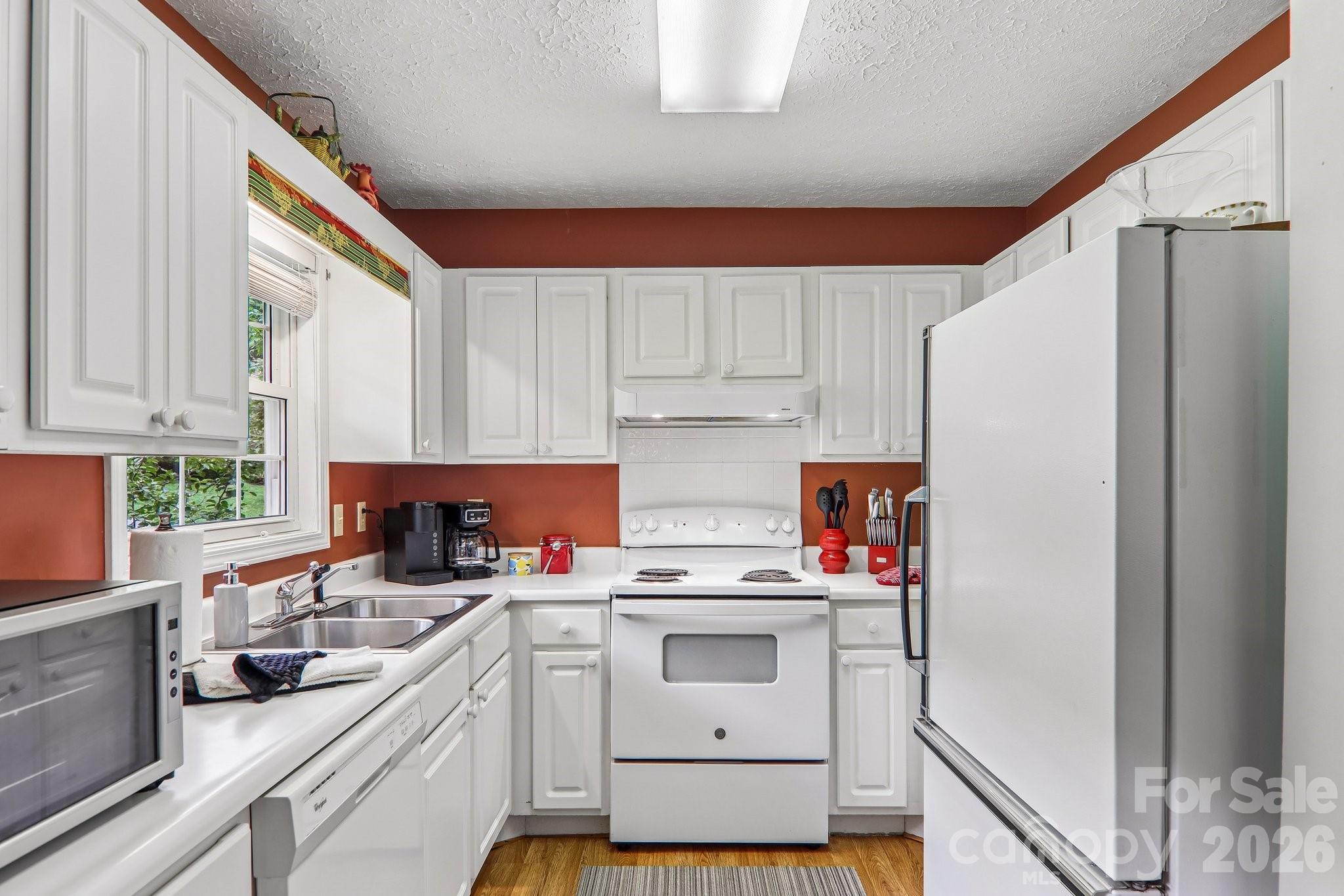 Whtie cabinets with window overlooking yard - 169 Highview Drive, Maggie Valley