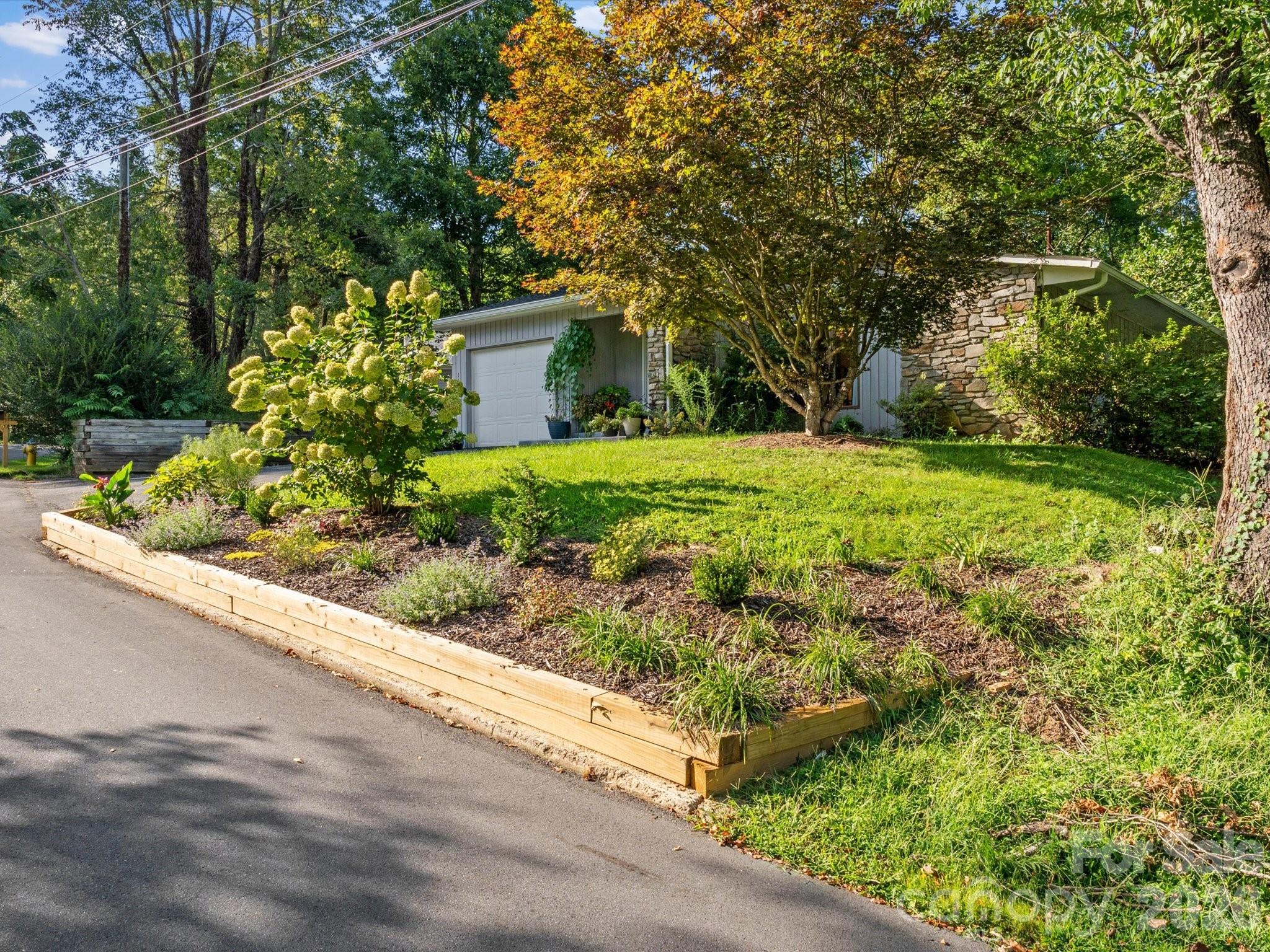 With a quiet, unassuming yet beautiful street view - 110 Aurora Drive, Asheville