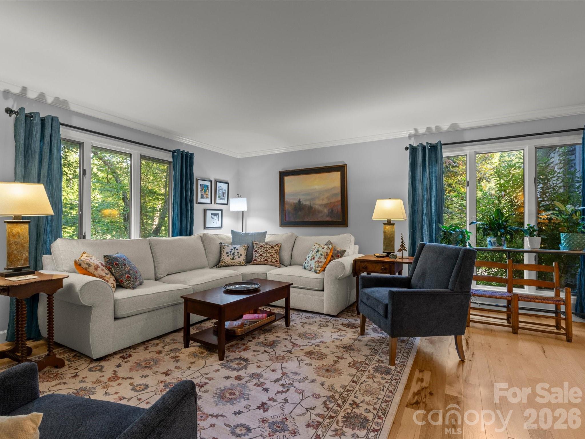 Huge windows send sunlight into every corner of the living room - 110 Aurora Drive, Asheville