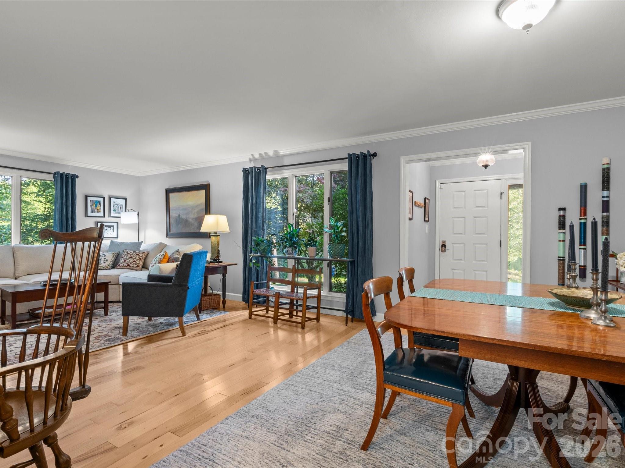 White oak hardwood floors sparkle throughout the living and dining areas - 110 Aurora Drive, Asheville