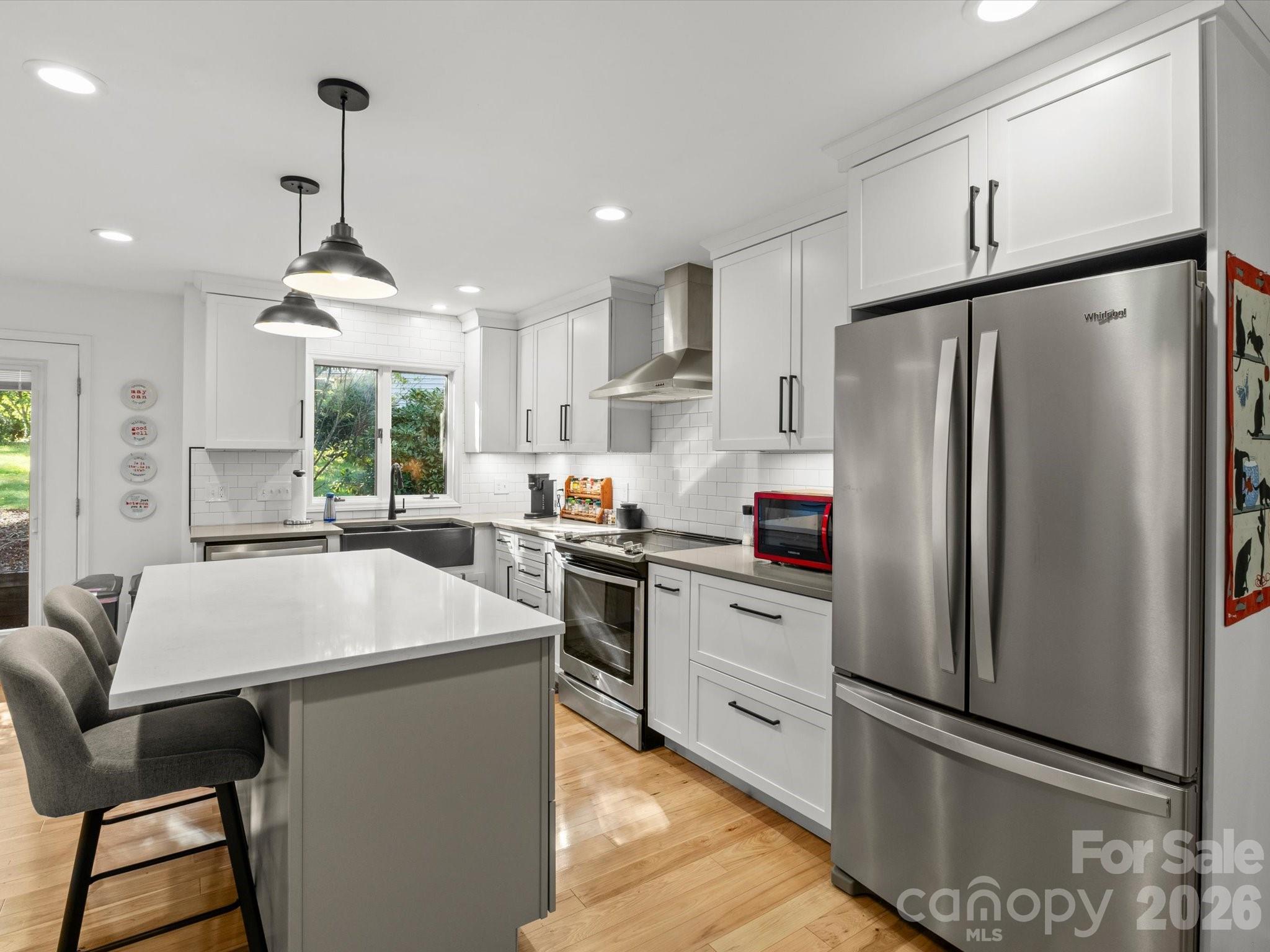 Stainless steel appliances and expansive cabinetry - 110 Aurora Drive, Asheville
