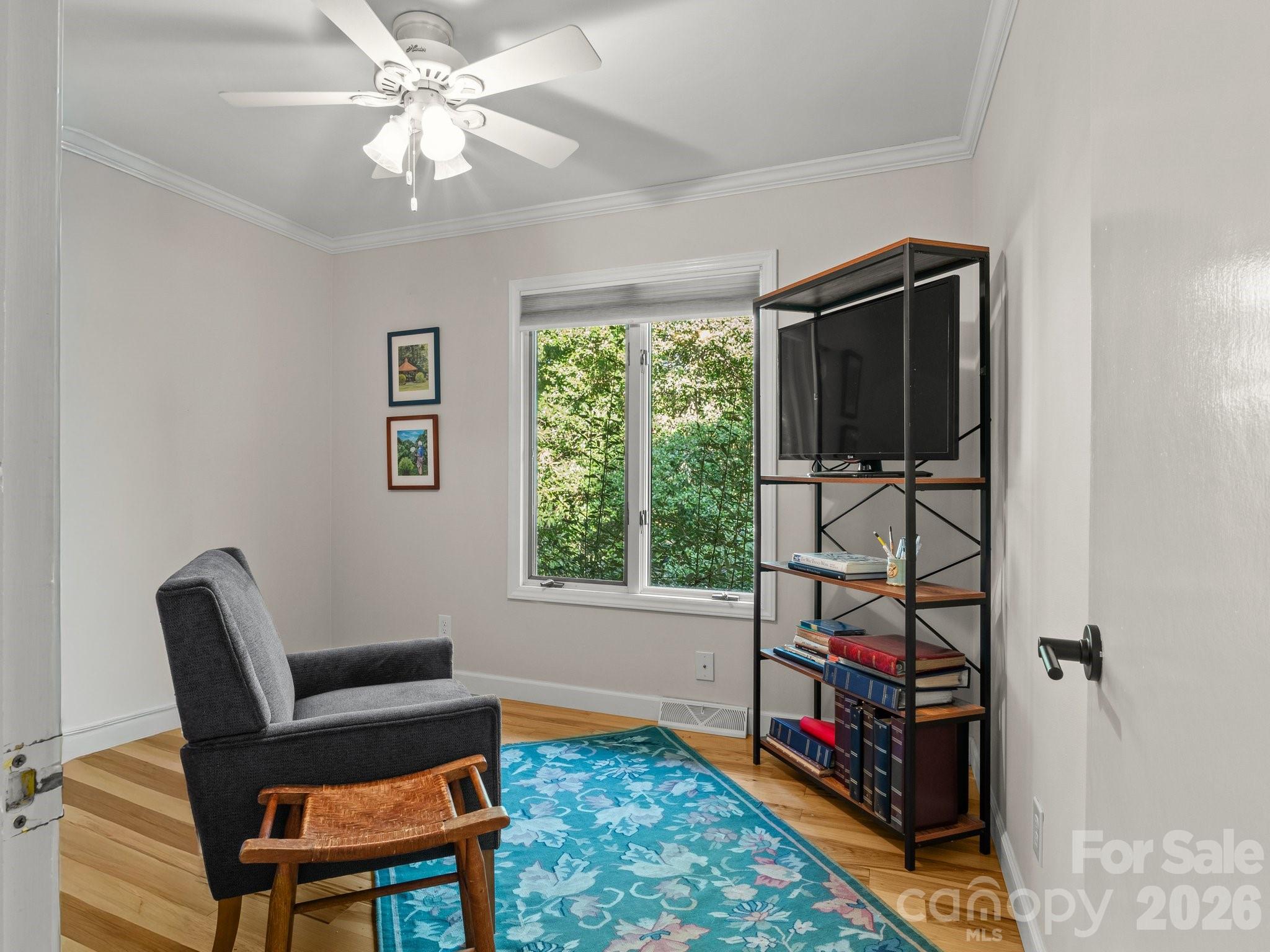 The third bedroom also features a big bright window and hardwood floors - 110 Aurora Drive, Asheville