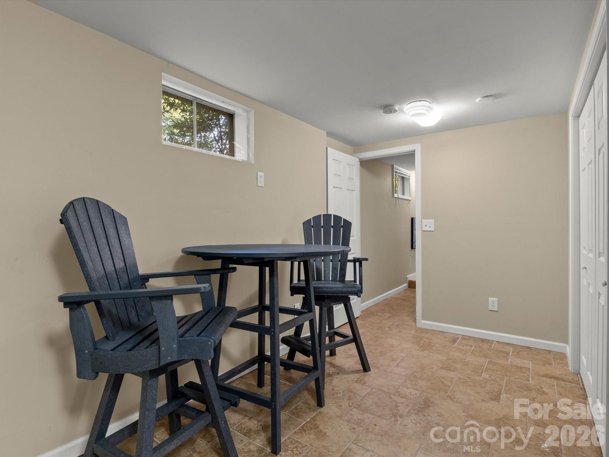 This lower level room has potential for a number of uses - 110 Aurora Drive, Asheville