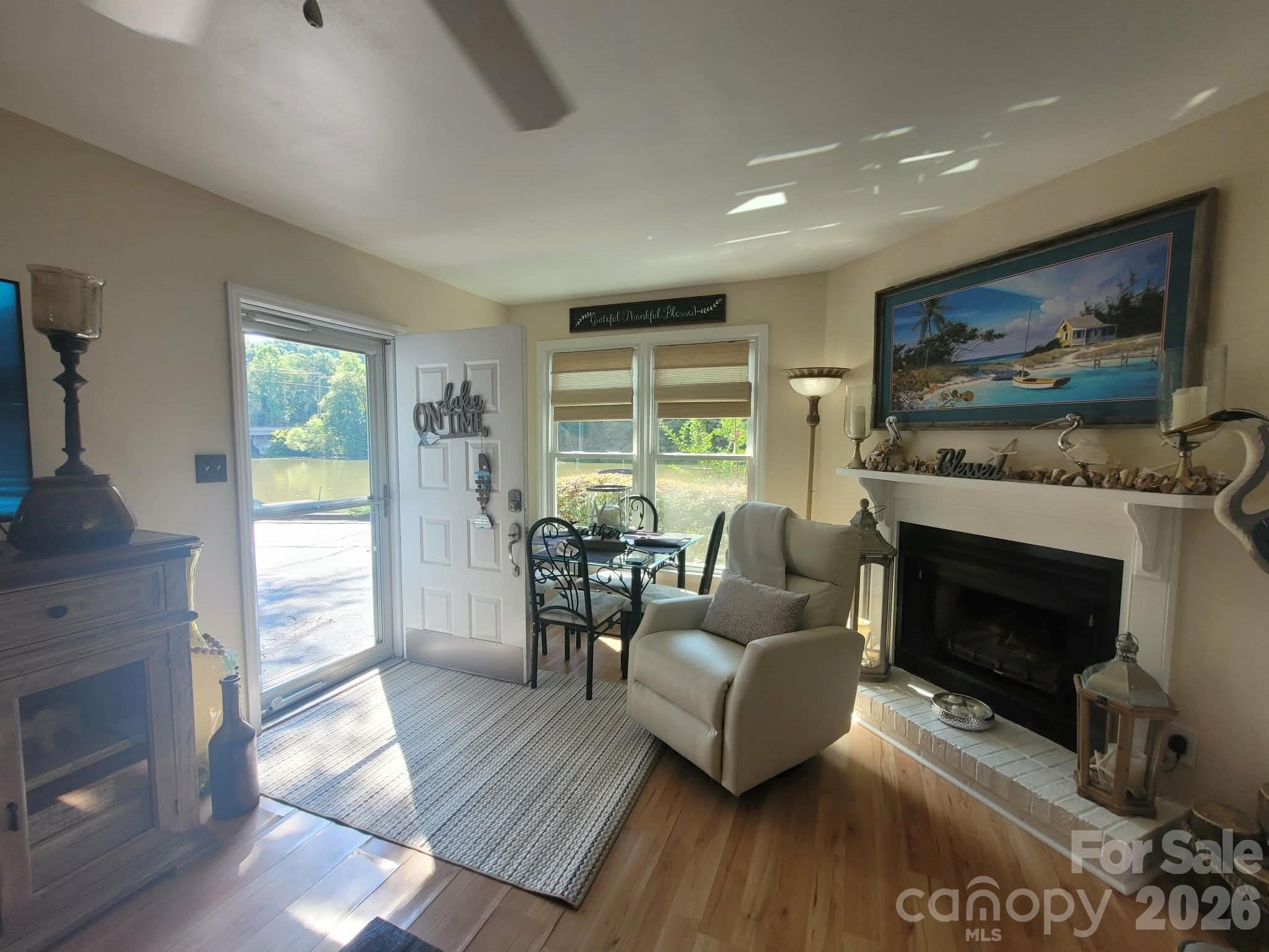 LR lake view and fireplace - 2200 6th Street NW, Hickory