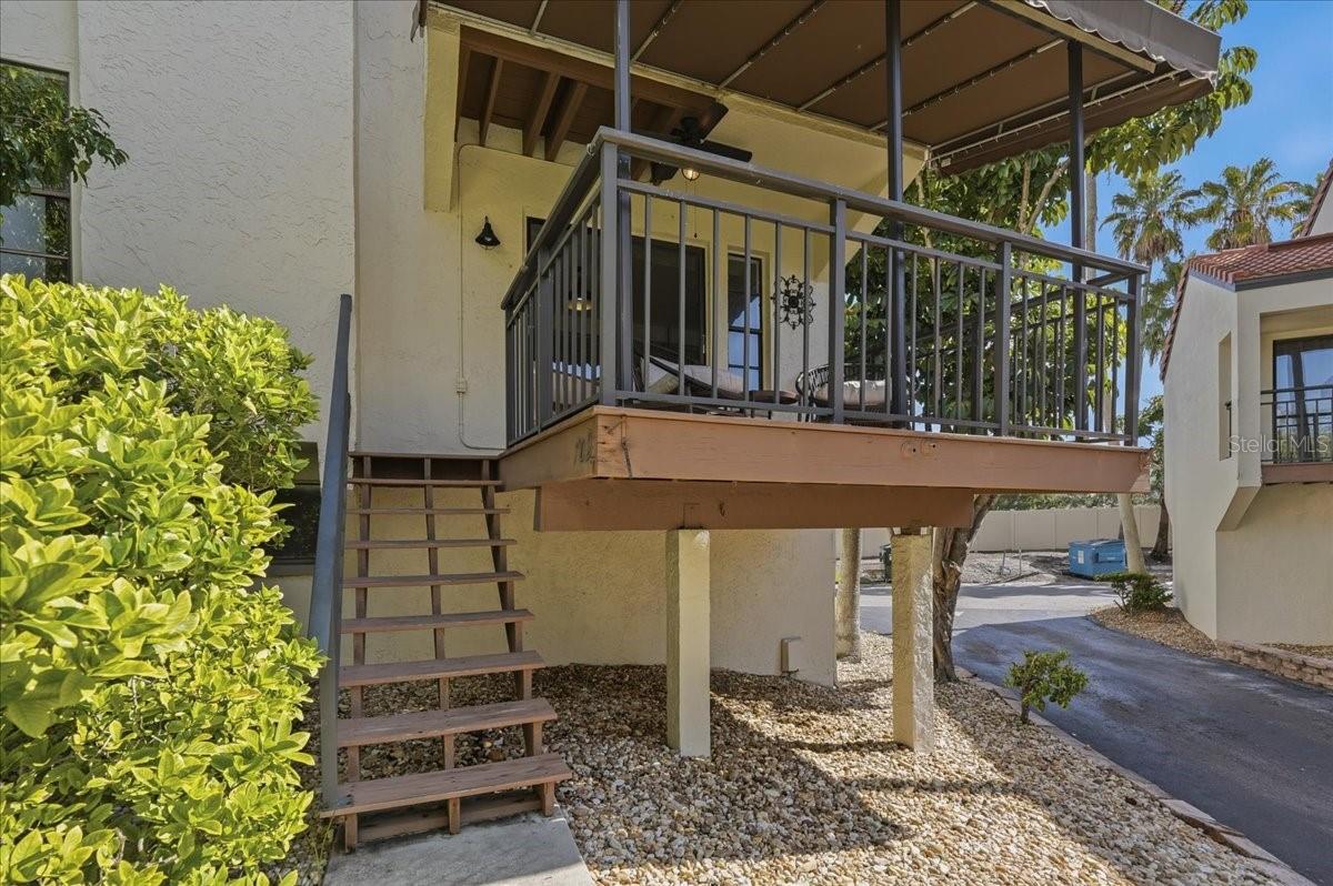 This elevated, covered porch serves as the perfect outdoor extension of the home, offering an ideal setting for morning coffee, evening relaxation, or seamless outdoor entertaining. - 240 WINDWARD PSGE #702, CLEARWATER
