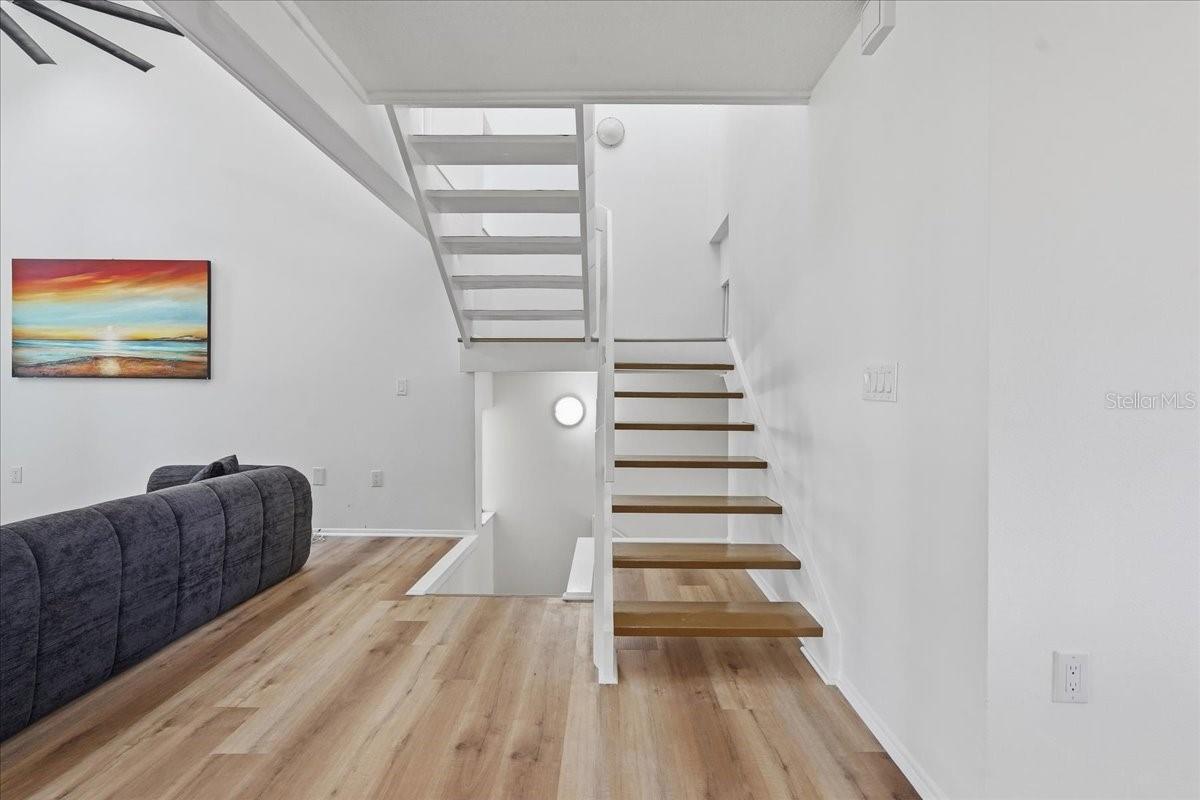 Stairway to the Double Primary Bedrooms - 240 WINDWARD PSGE #702, CLEARWATER