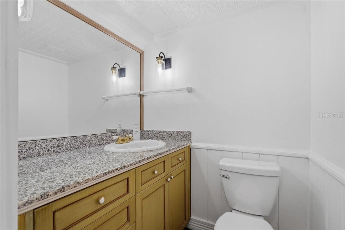 Ideally (and discreetly) located Half Bathroom for the living area - 240 WINDWARD PSGE #702, CLEARWATER