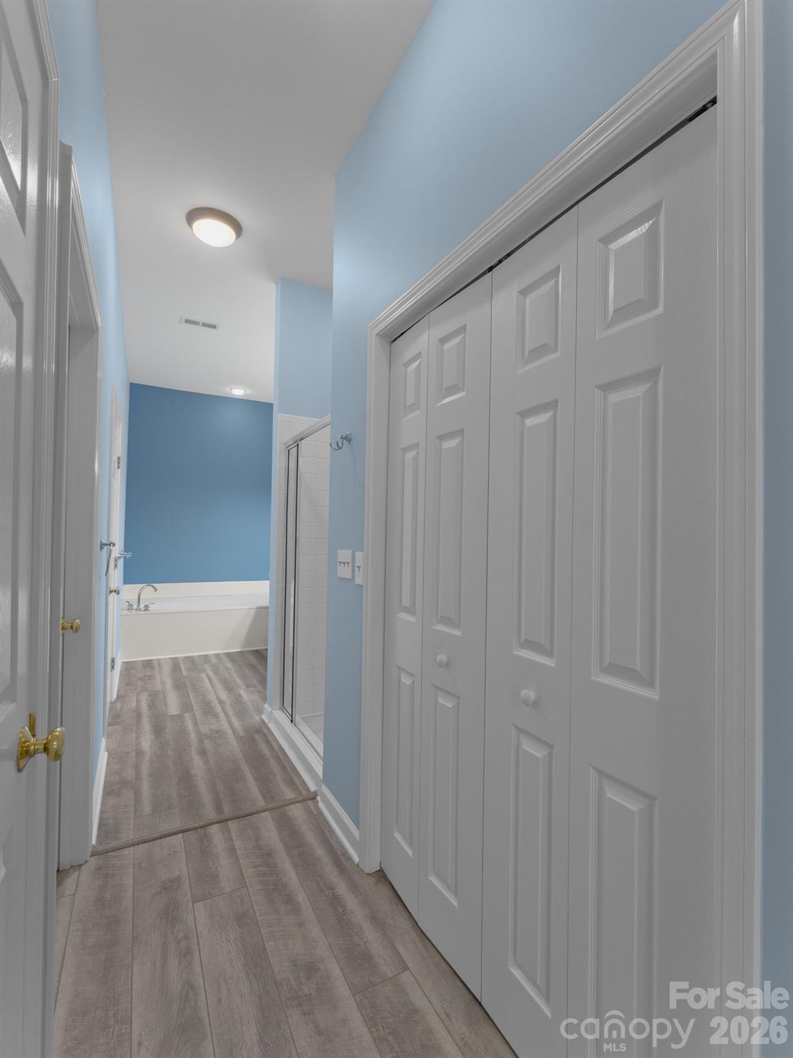 Primary Ensuite Bathroom and Closets - 47 Ridgetop Circle, Brevard