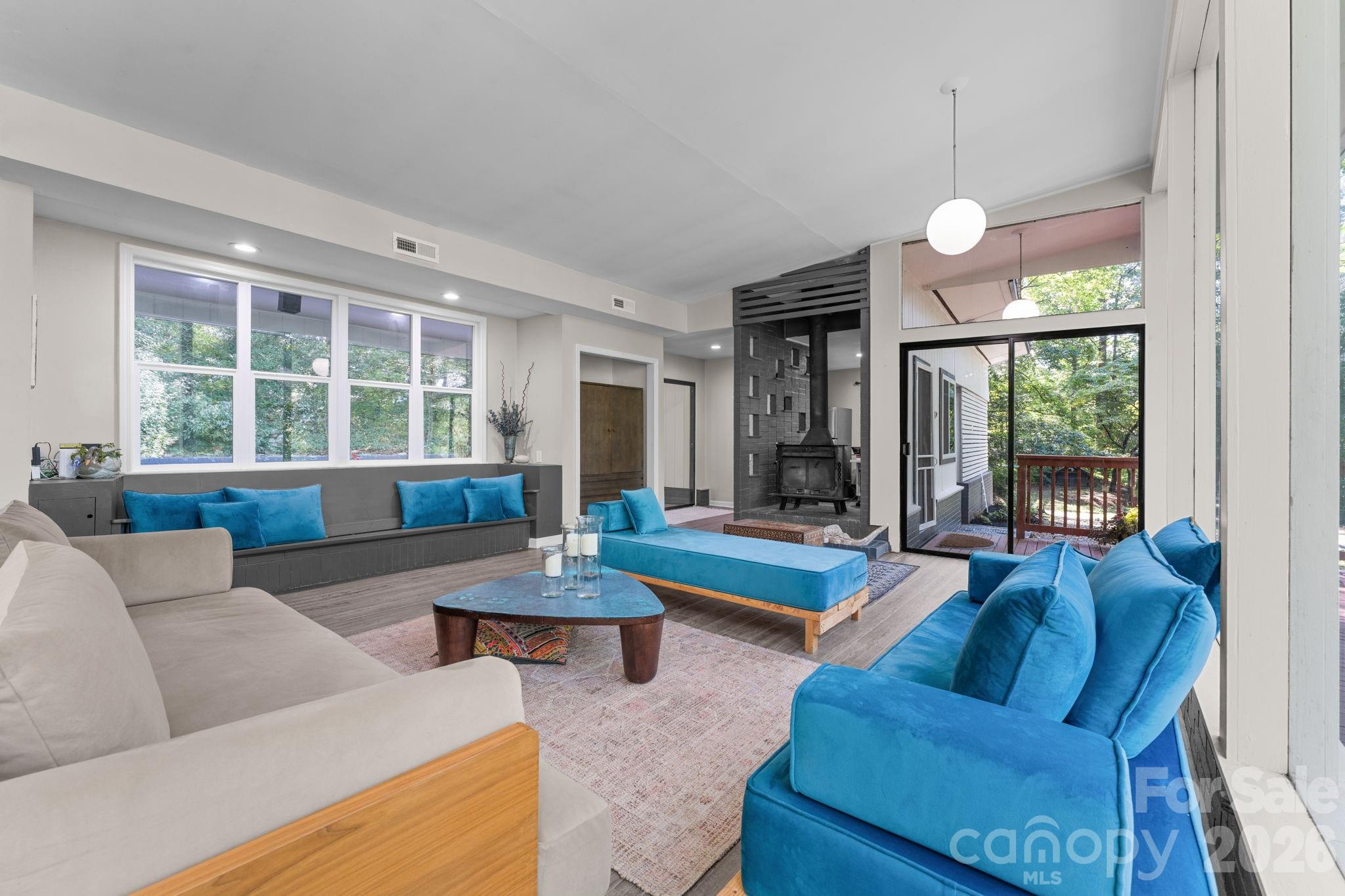 Great Room with Wood Stove & View towards the Kitchen, Deck & Back Patios - 103 Riverwood Drive, Sylva