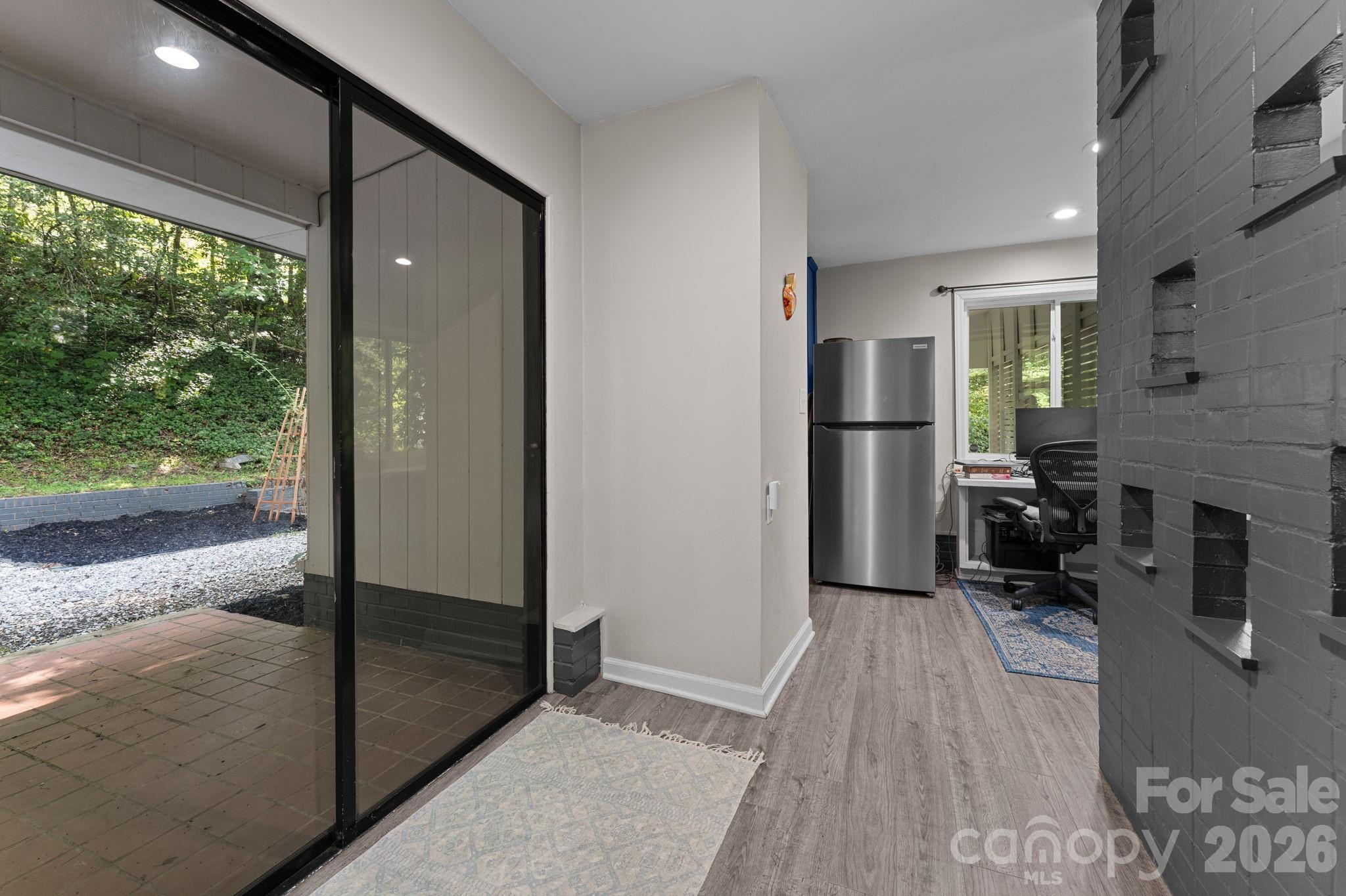 Slider to Back Patio, Kitchen and Office Nook Ahead - 103 Riverwood Drive, Sylva