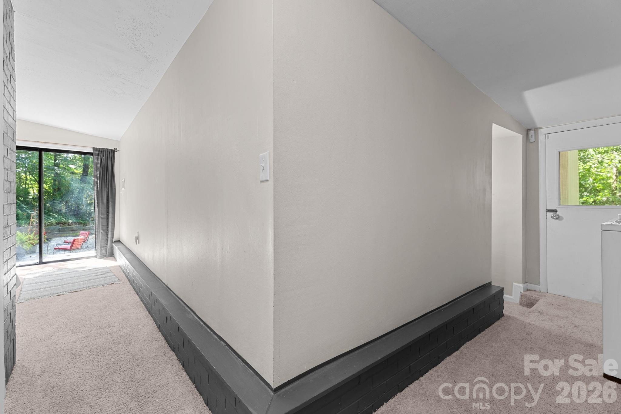 Hallway from Laundry Area to Primary Bedroom - 103 Riverwood Drive, Sylva