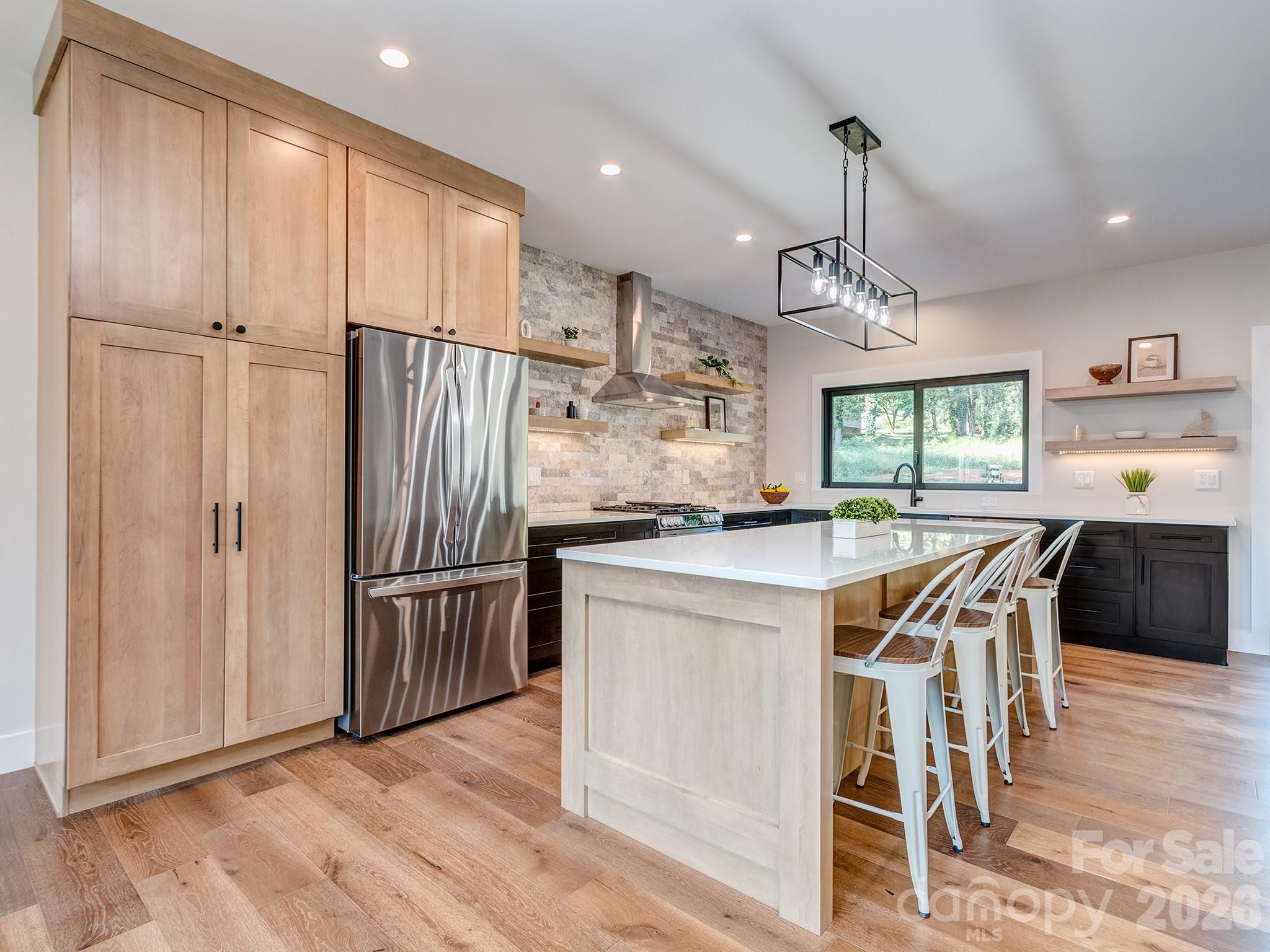Kitchen with custom cabinets - 4899 Moonlite Bay Drive, Sherrills Ford