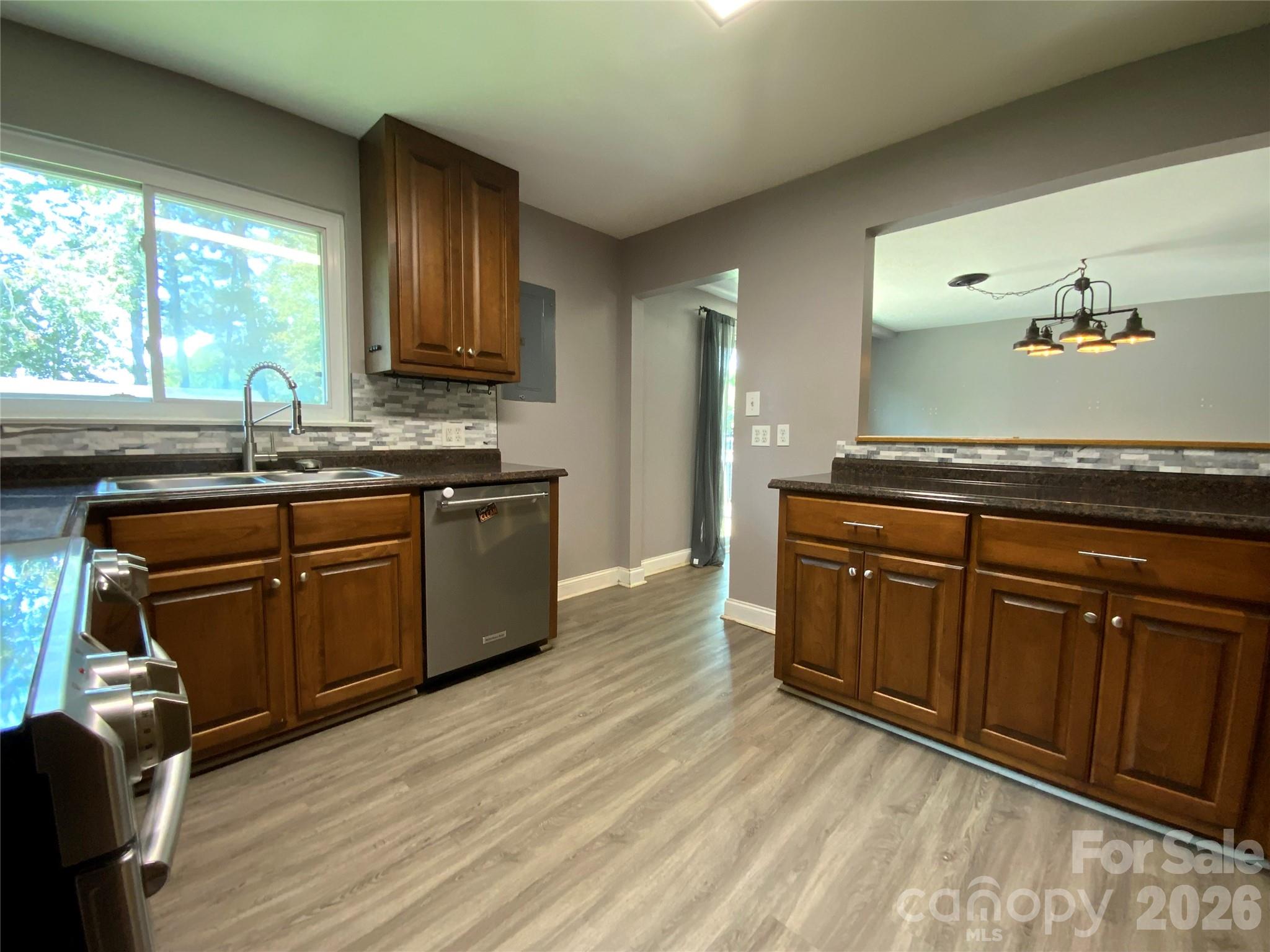 Kitchen is adjacent to the dining area - 325 Glenwood Drive, Mooresville
