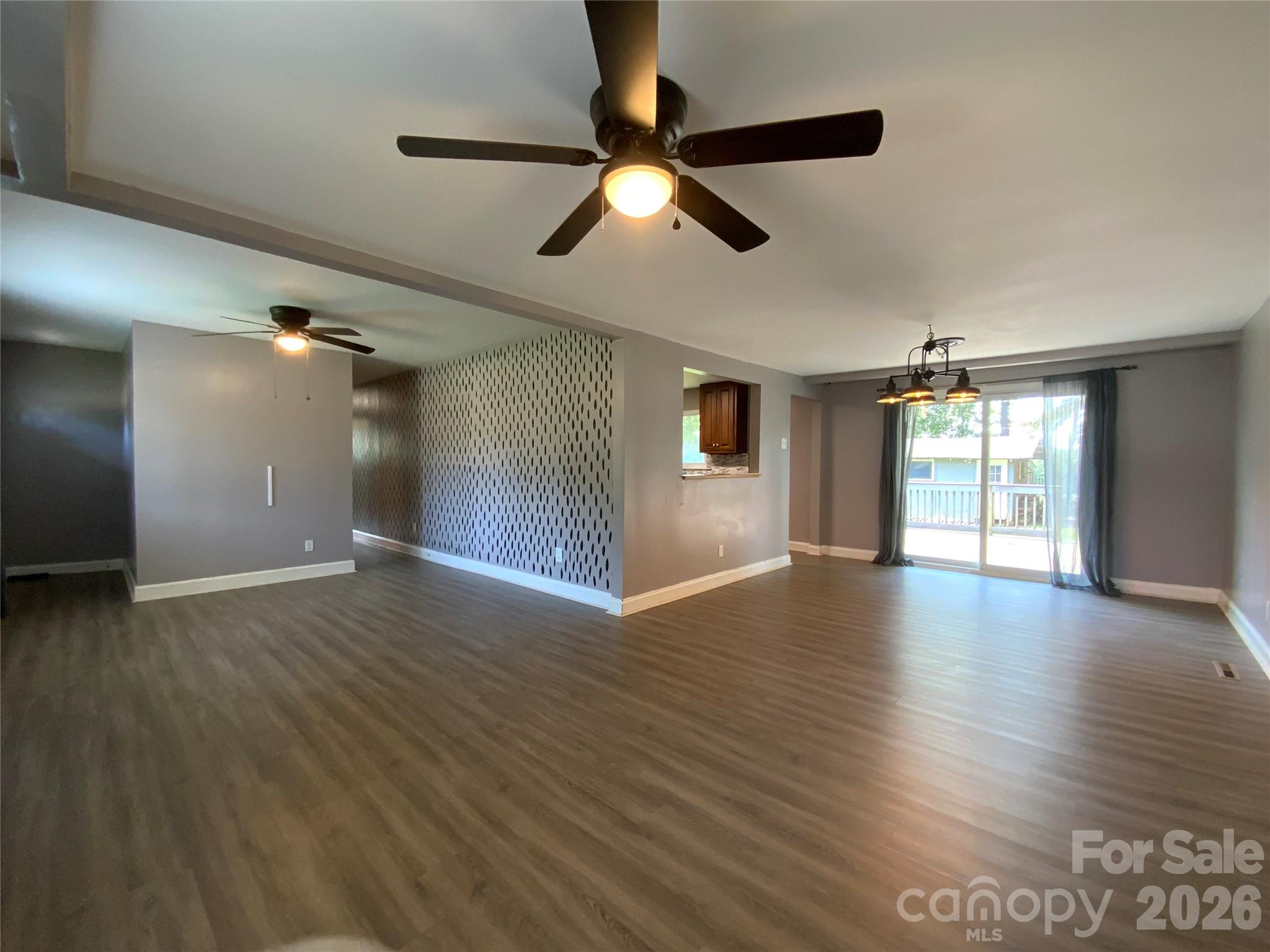Open living area with a ceil fan. - 325 Glenwood Drive, Mooresville