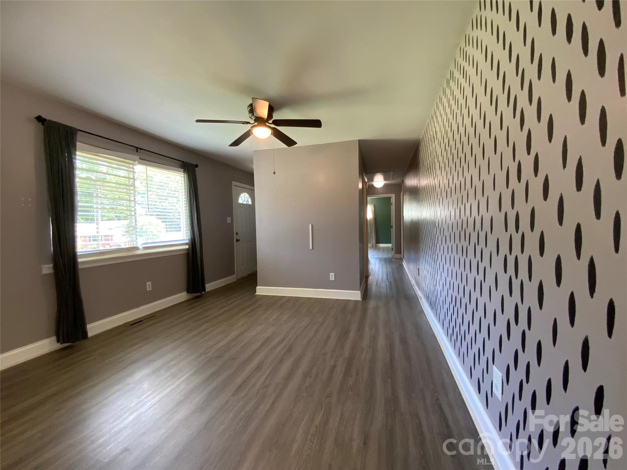 Front entry way, hallway with a ceil fan. - 325 Glenwood Drive, Mooresville