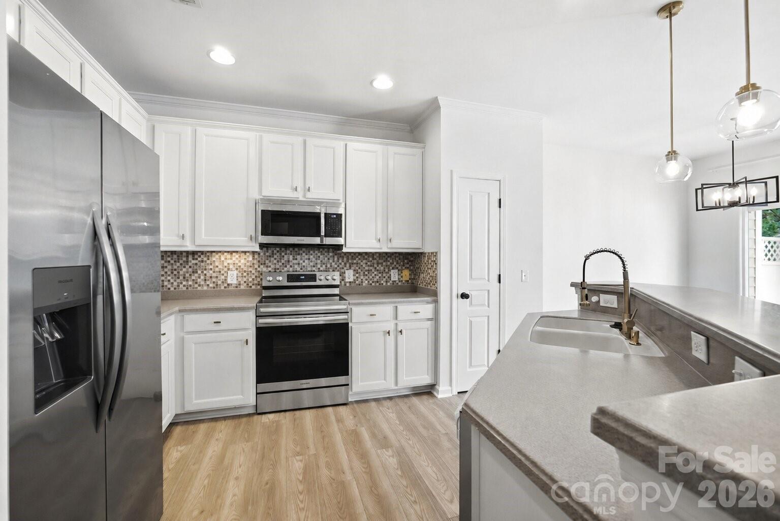 Oven/range virtually added as it was not installed at time of photos. Exact model is photoshopped into the picture - 461 River Park Road, Belmont