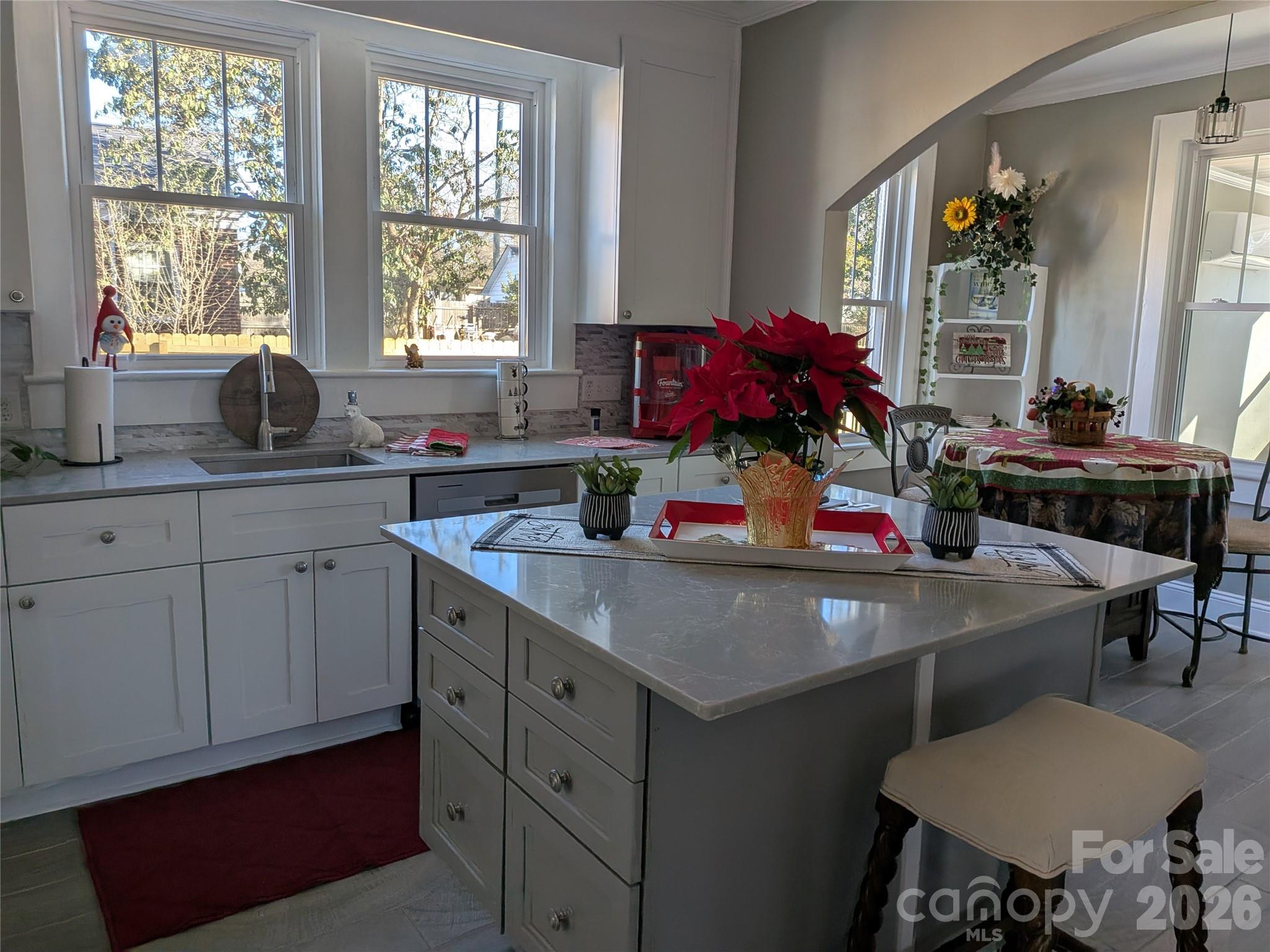 Gorgeous kitchen w/island cabinet on wheels, quartz counters, soft closing drawers & a cozy, welcoming breakfast knook. - 933 W Warren Street, Shelby