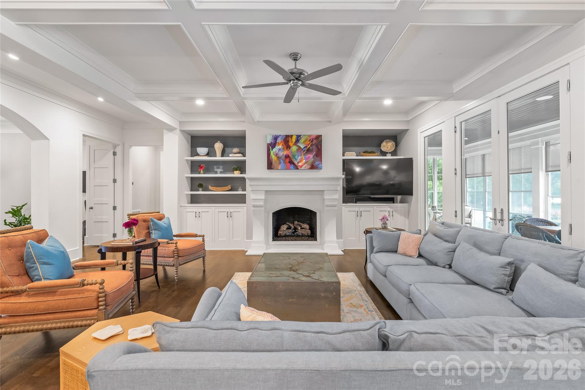 The heart of this home is rich with detail. Wooden coffered ceiling, Gas fireplace with Limestone Mantle and built in book cases. - 2800 Wintergreen Drive, Charlotte