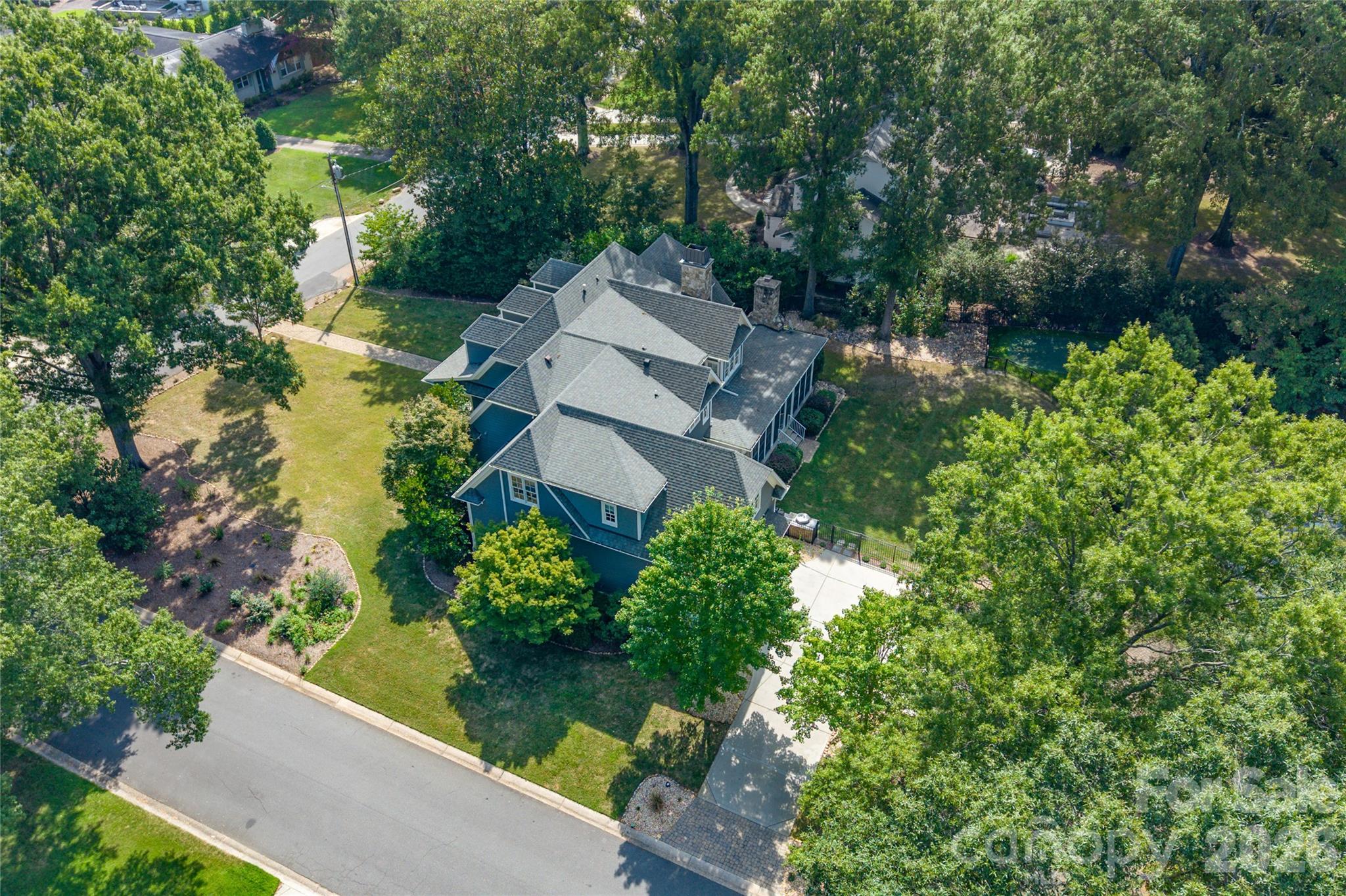 Over 5200 + sq ft of thoughtfully designed living space, tucked away behind mature landscaping in one of Charlotte's most desirable locations - 2800 Wintergreen Drive, Charlotte