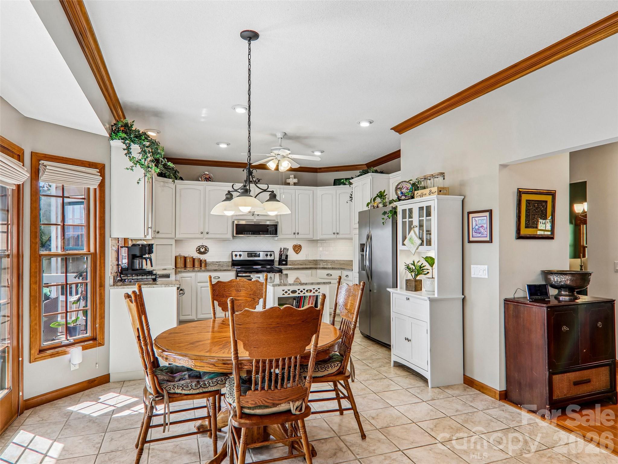 Breakfast area open to the kitchen. Crown molding, tile flooring into kitchen. - 16 Hobe Crest, Hendersonville