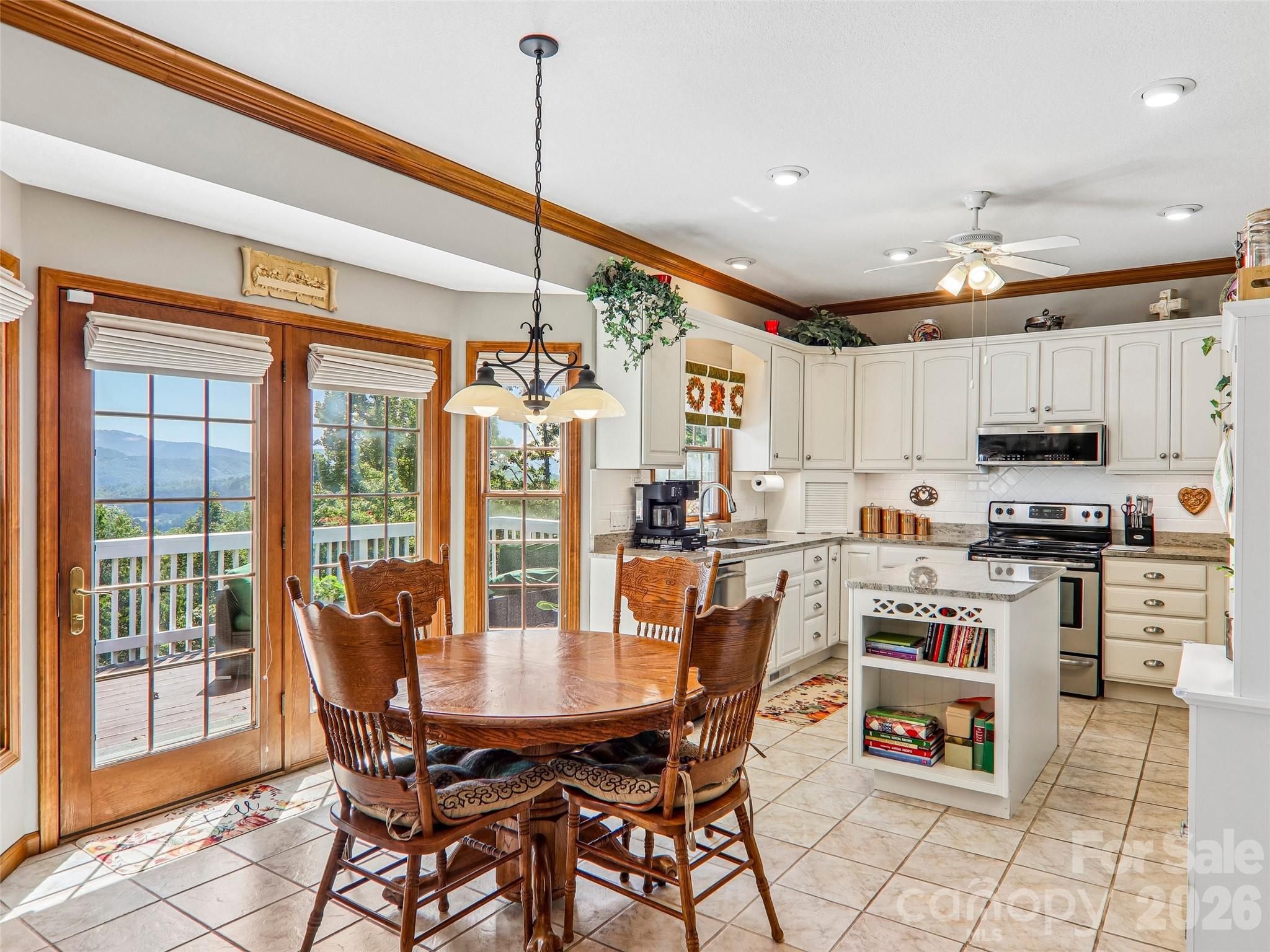 Breakfast area with french doors to the back deck and entertainment space and mountain views. - 16 Hobe Crest, Hendersonville