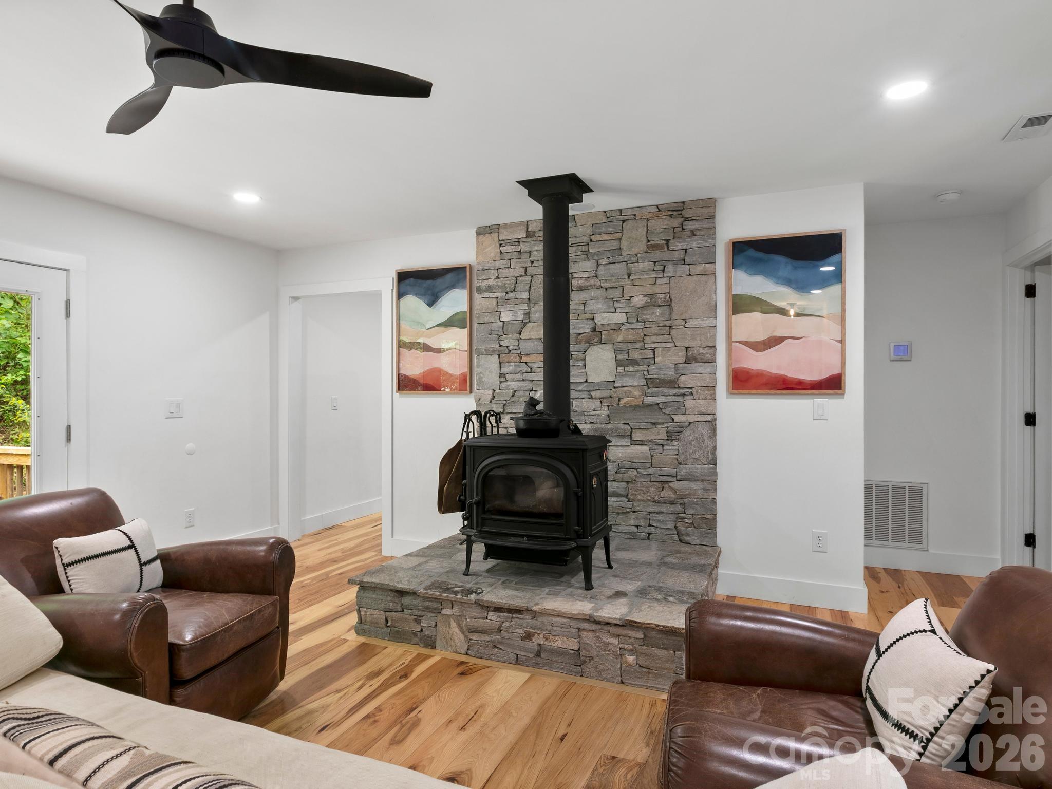 Aesthetic and functional wood stove focal point in the living room. - 41 Bear Trail, Fairview