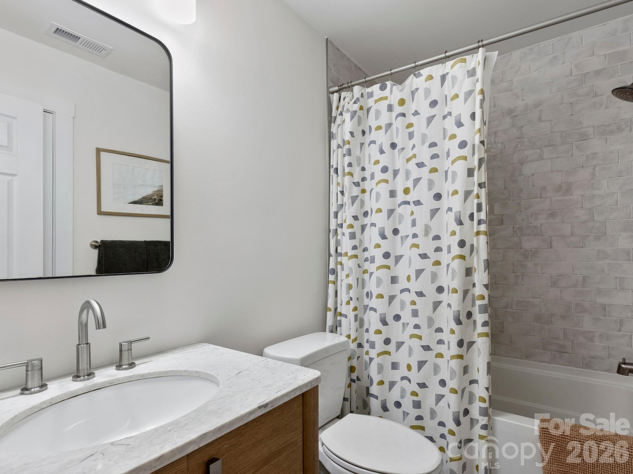Spare bathroom with tile floors and tub surround. - 41 Bear Trail, Fairview