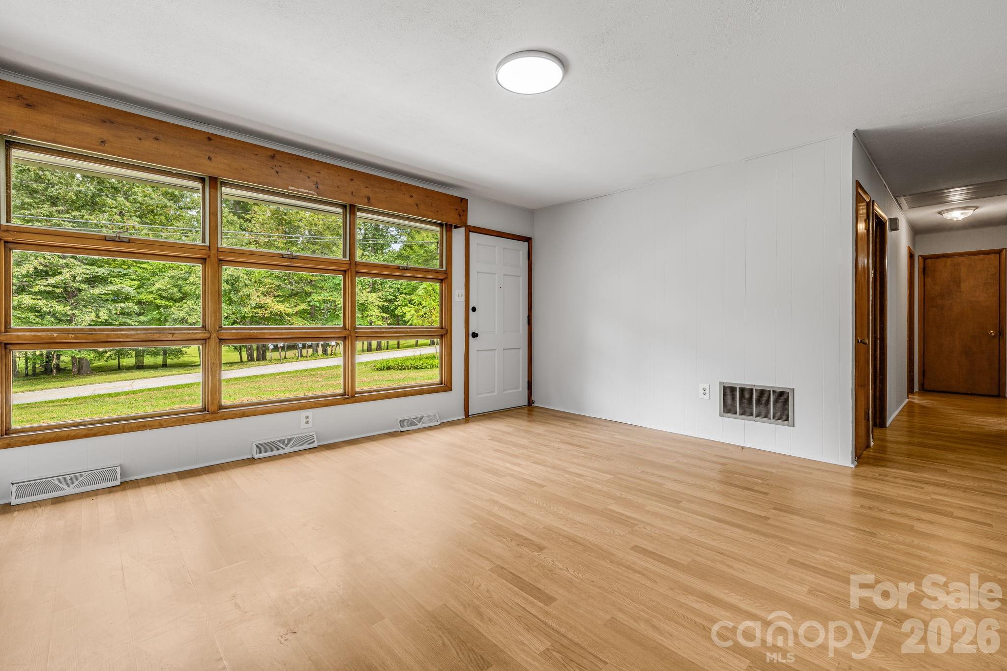 open living room with lots of natural light - 25 Hickory Tree Road, Asheville