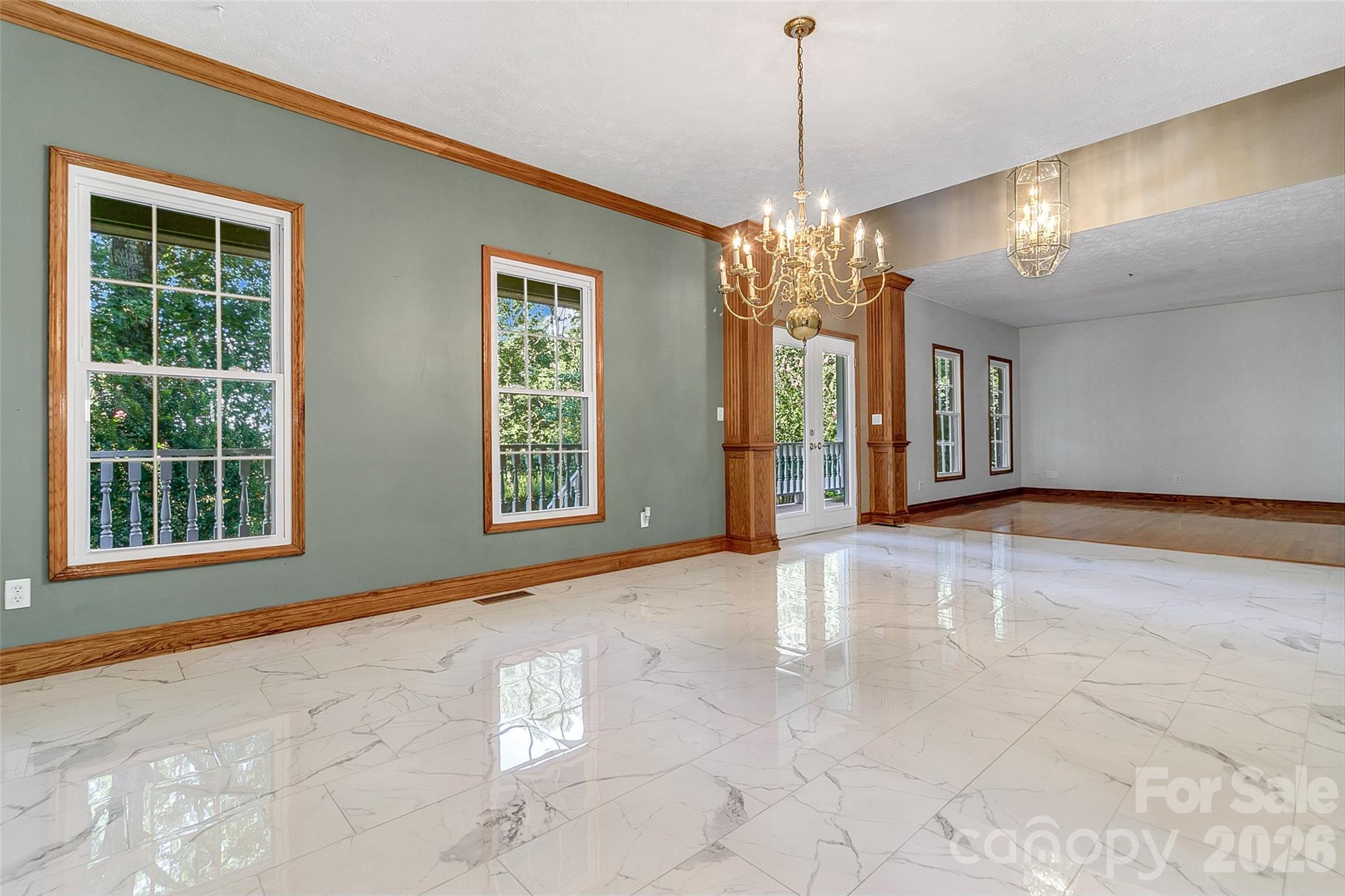 Dining room View to front door and through to formal living room or flex space. - 287 Shady Creek Lane, Hendersonville