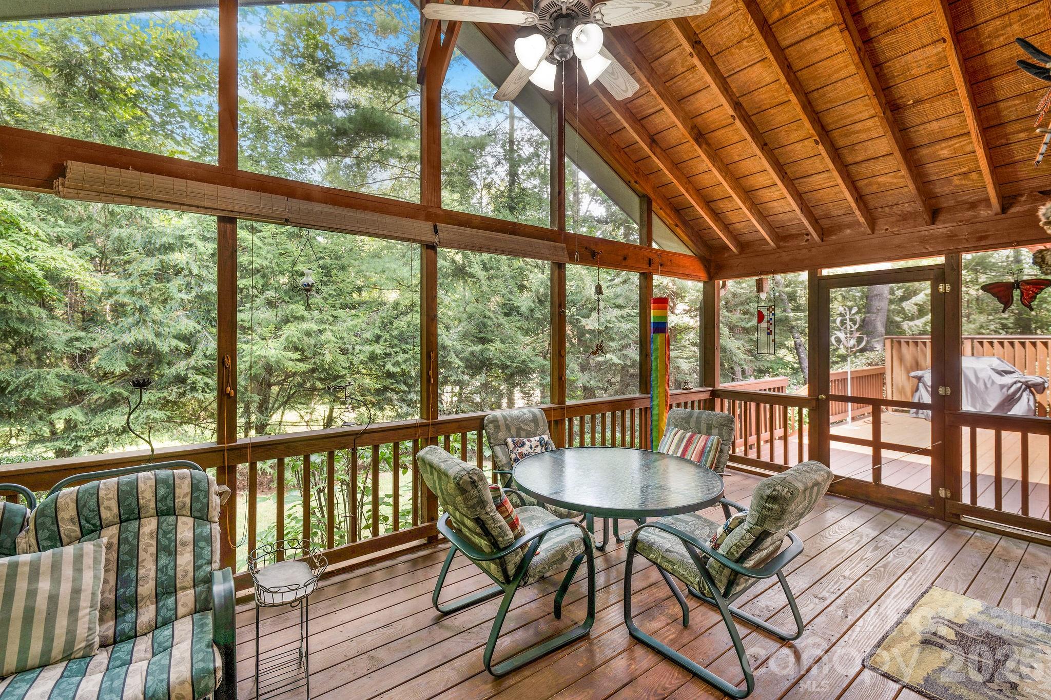 The screen porch is a stand-out feature of this one level home. - 31 Hillcreek Drive, Asheville