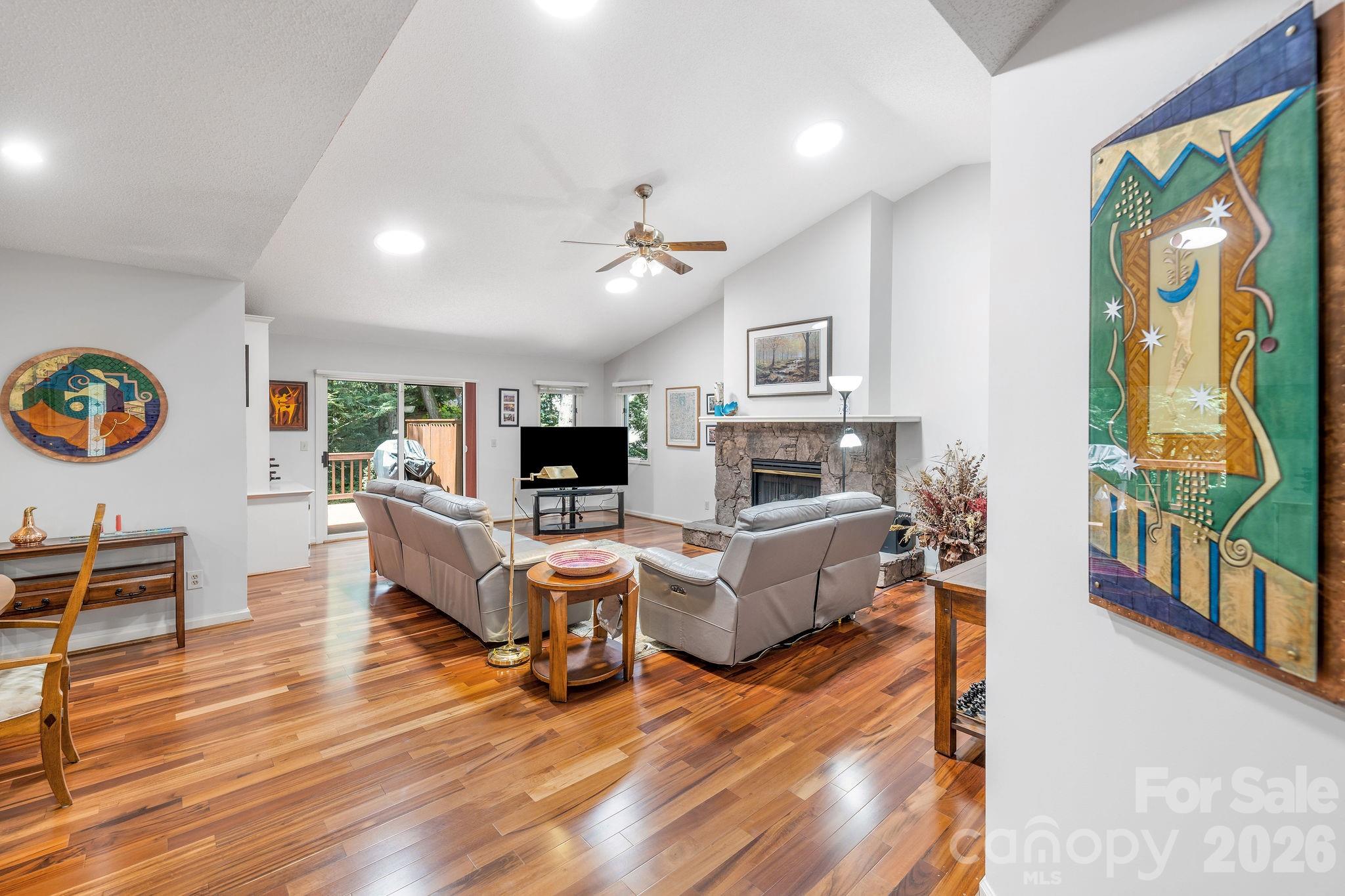 Sun tunnels in the vaulted ceilings provide natural light into the open living room space. - 31 Hillcreek Drive, Asheville