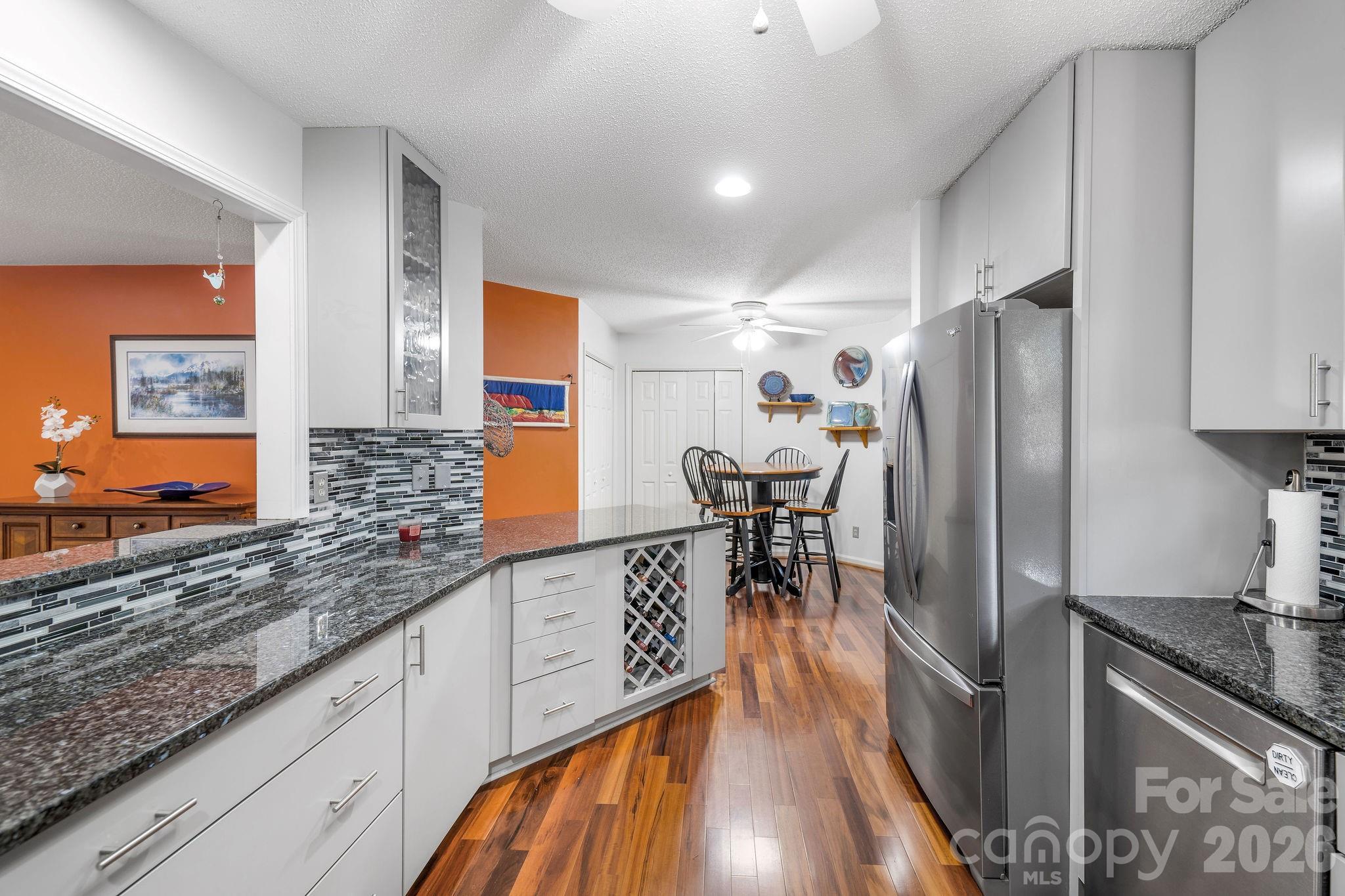 The abundant kitchen storage includes a built-in wine rack and there are pantry closets in the breakfast nook area. - 31 Hillcreek Drive, Asheville