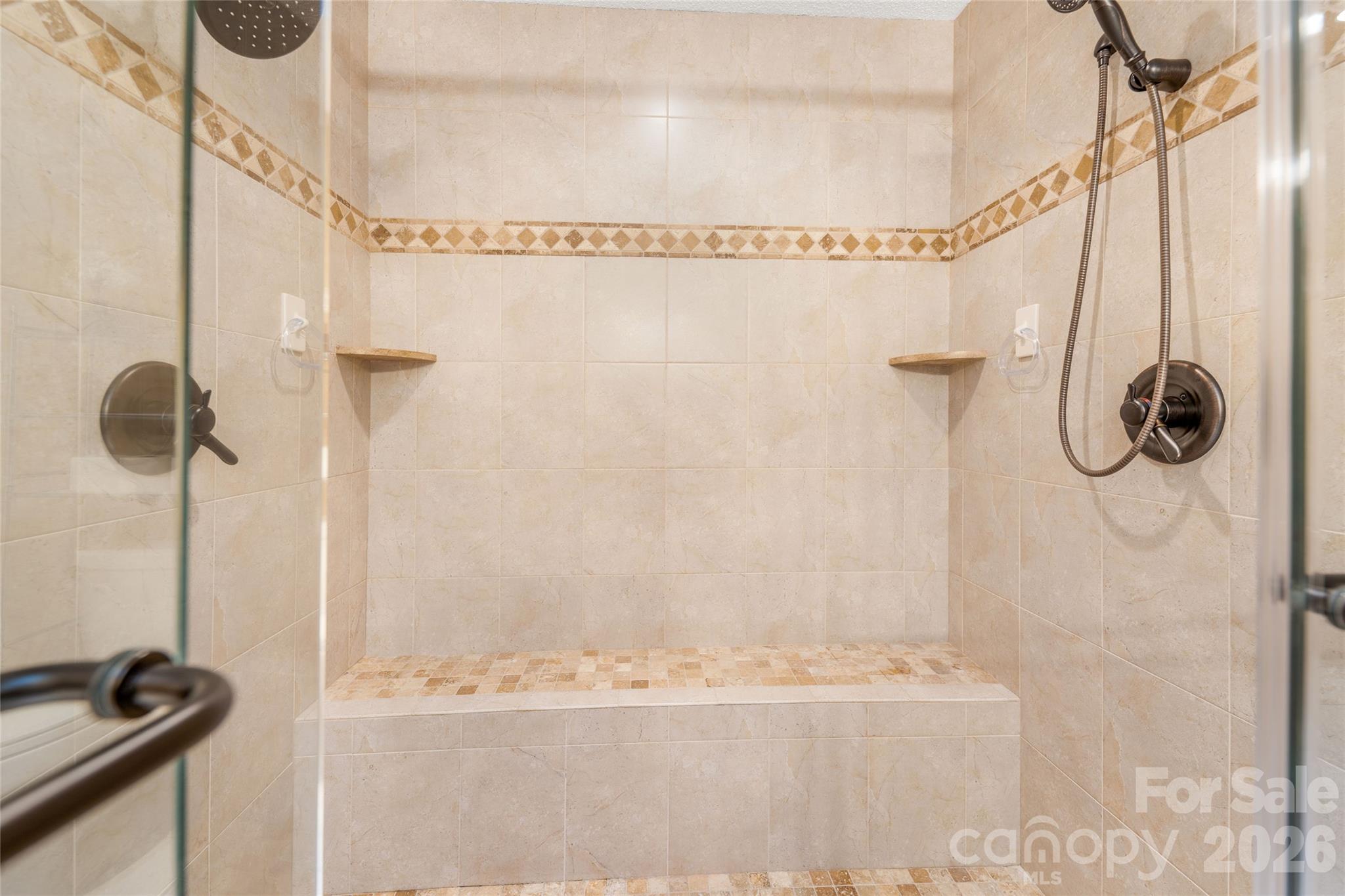 Fully tiled walk in shower with dual shower heads. - 31 Hillcreek Drive, Asheville