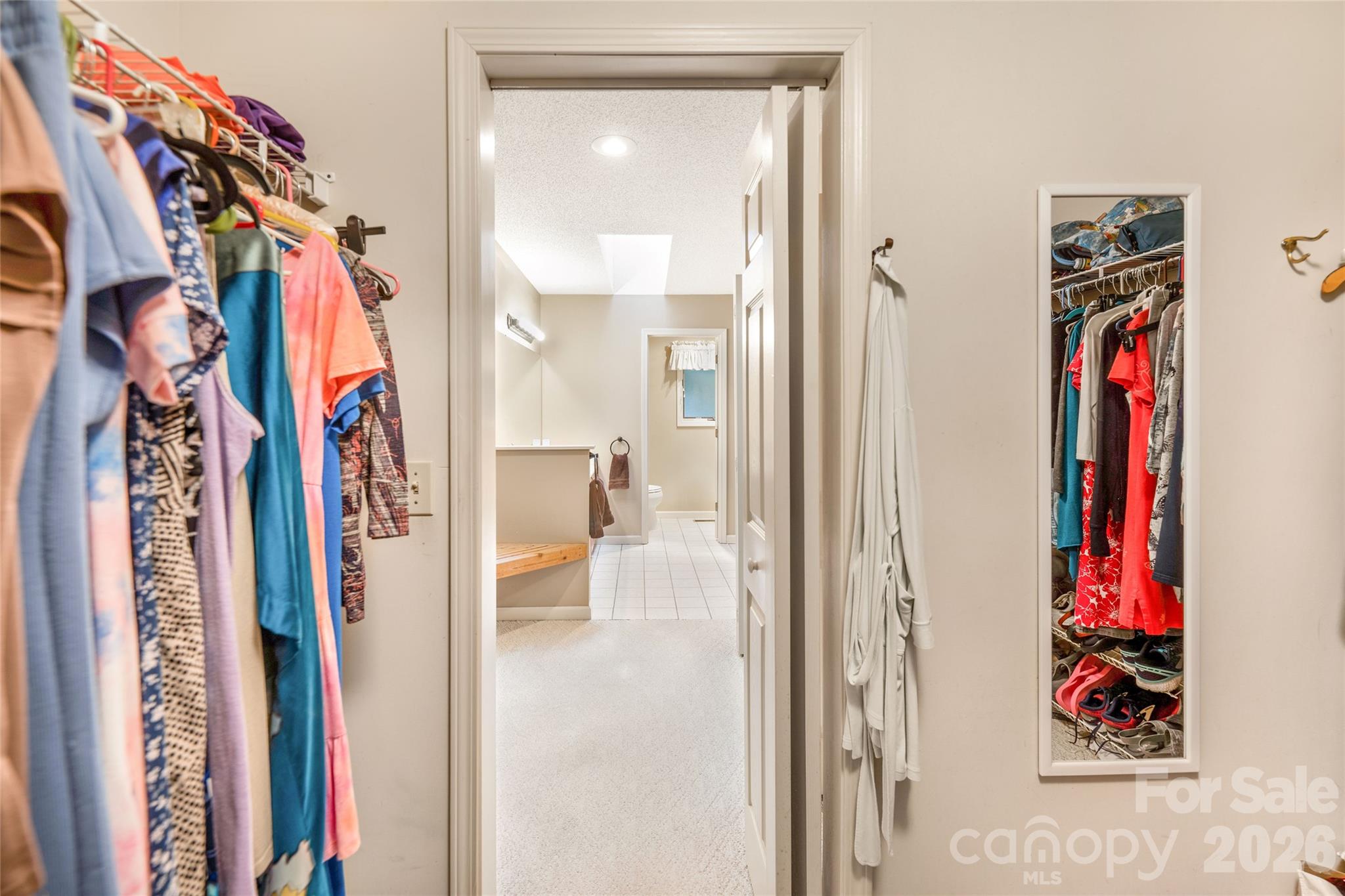 One of two walk in primary walk in closets. - 31 Hillcreek Drive, Asheville