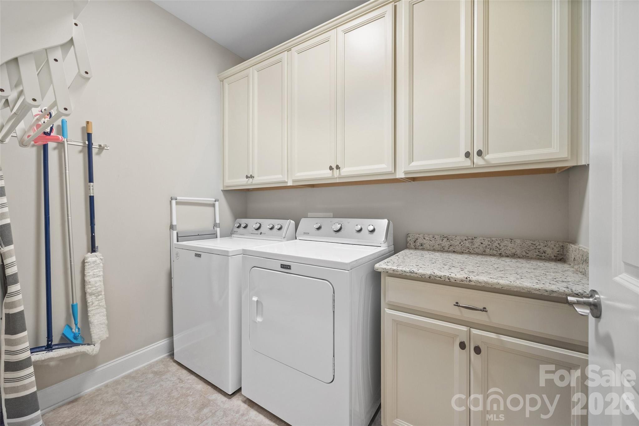 Laundry room with cabinetry - 420 Trillium Way, Belmont