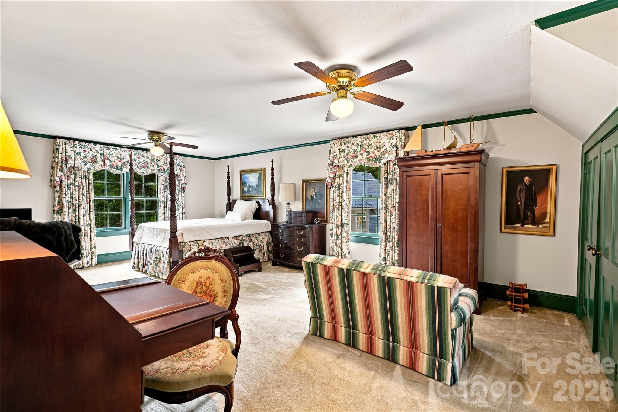 Spacious upper-level primary bedroom with dormer windows and sitting space. - 209 Labans Lane, Lincolnton