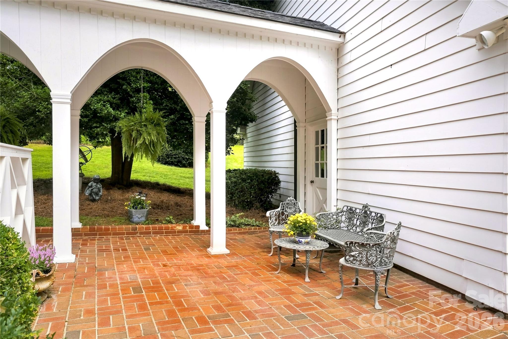 Arched covered breezeway connecting the home and garage. - 209 Labans Lane, Lincolnton
