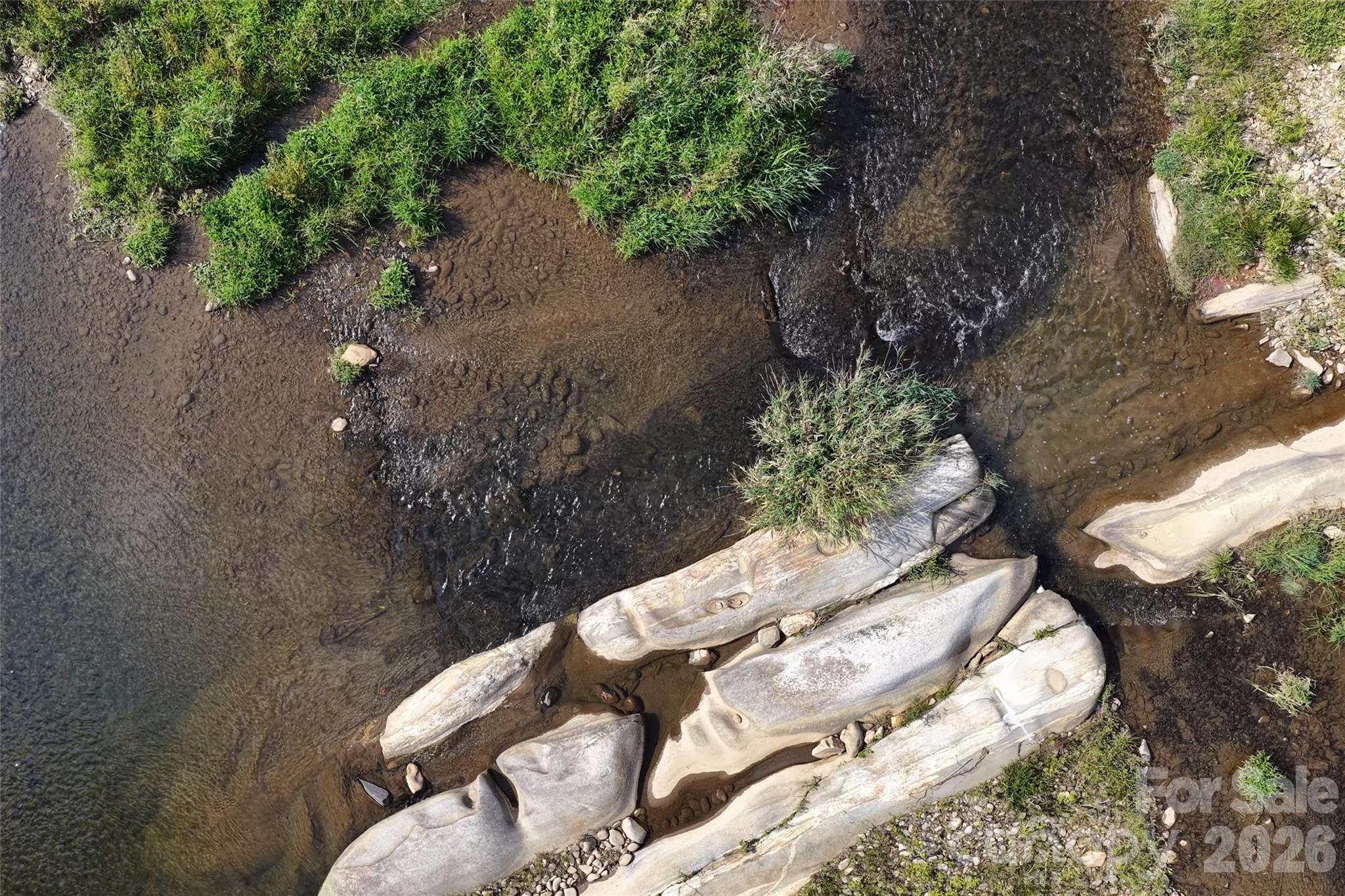 Wonder slow creek like water area and level island area. - 791 Mckinney Road, Burnsville