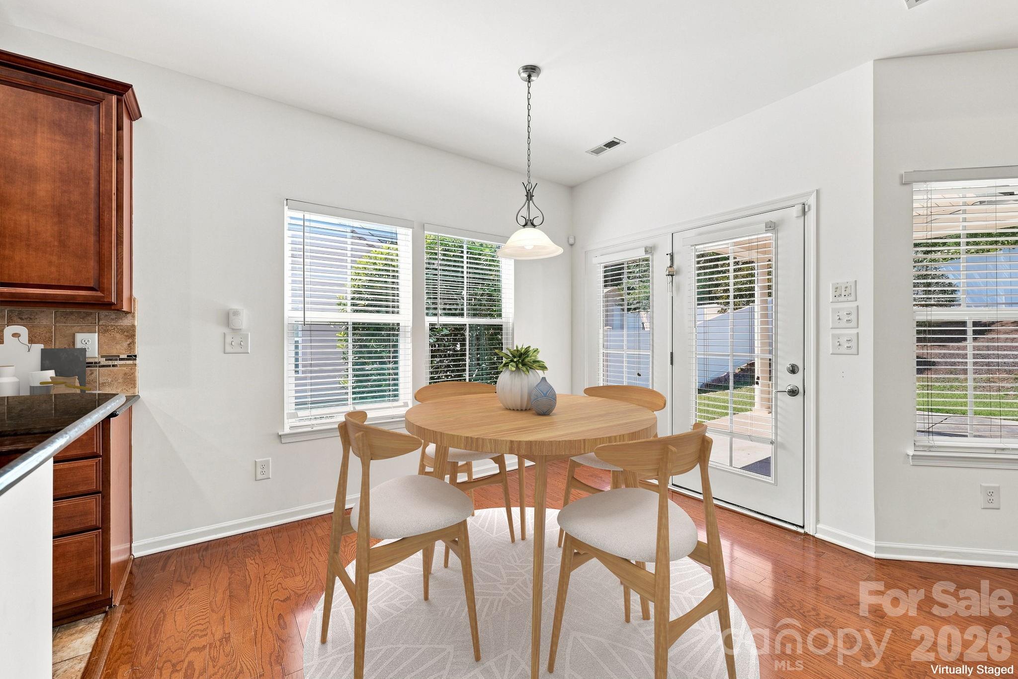 Breakfast nook in kitchen virtually staged - 593 Harrison Drive NW, Concord
