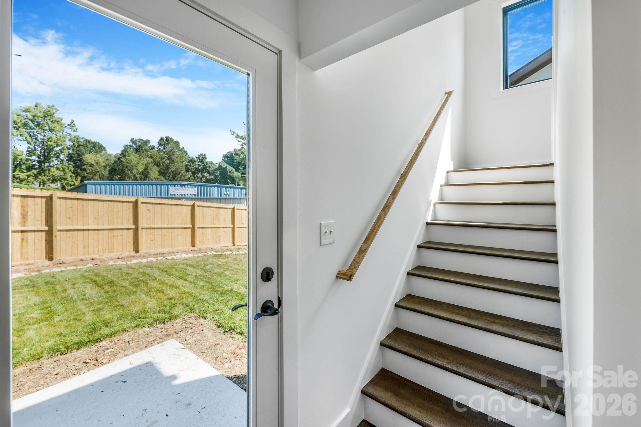 Backyard Access Near Kitchen with Stairwell to Upper Level - 138 Shiloh Road, Asheville