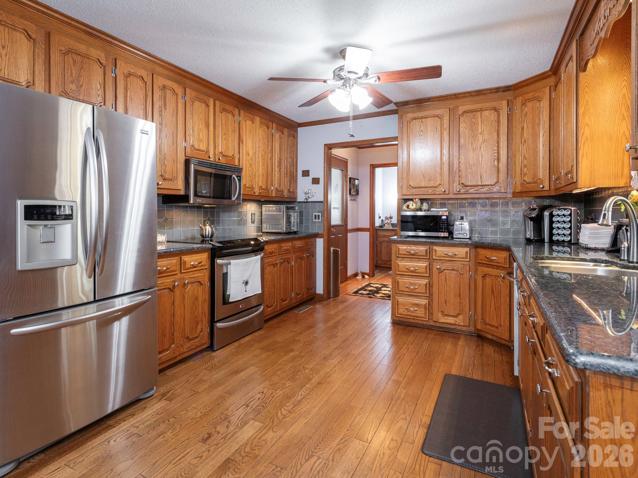 KITCHEN WITH LOTS OF CABINETS, GRANITE CT, HARDWOODS AND PULL OUR DRAWERS - 1800 Lake Lynn Road, Concord