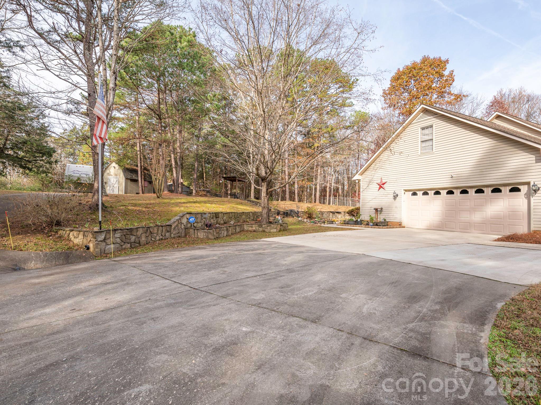 2 CAR GARAGE WITH EXTRA STORAGE ROOM AND SHELVES - 1800 Lake Lynn Road, Concord