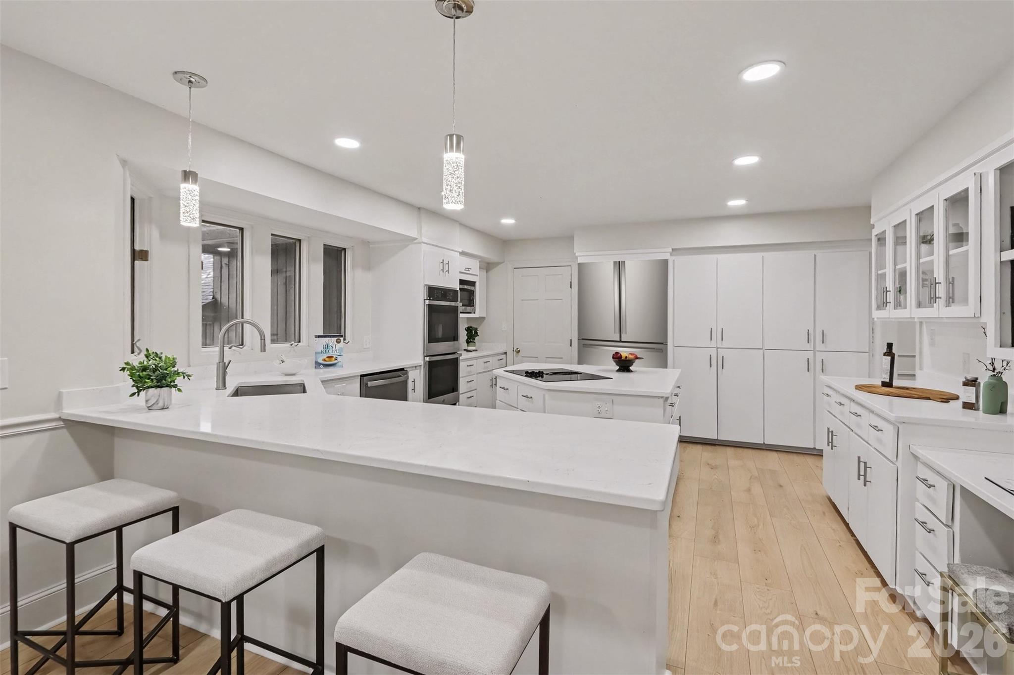 Yes, your new kitchen has a breakfast bar for the kiddos. - 5042 Marci Lane, Belmont