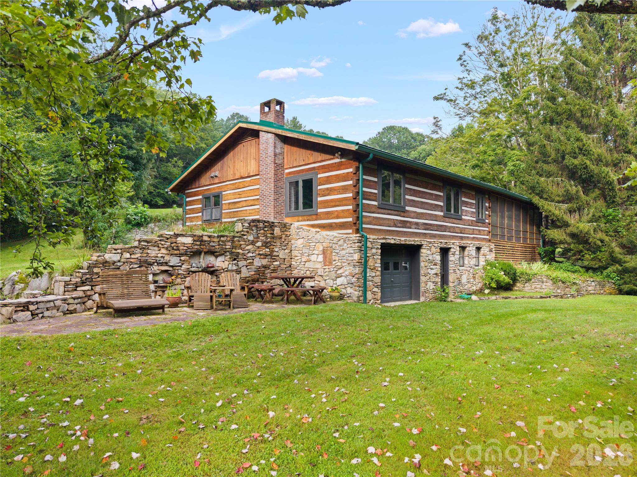 View of main house from pond - 1061 Indian Trail Road, Mars Hill