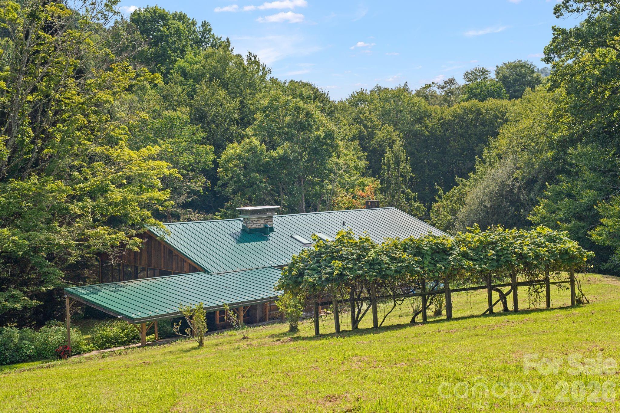 Main house from meadow - 1061 Indian Trail Road, Mars Hill