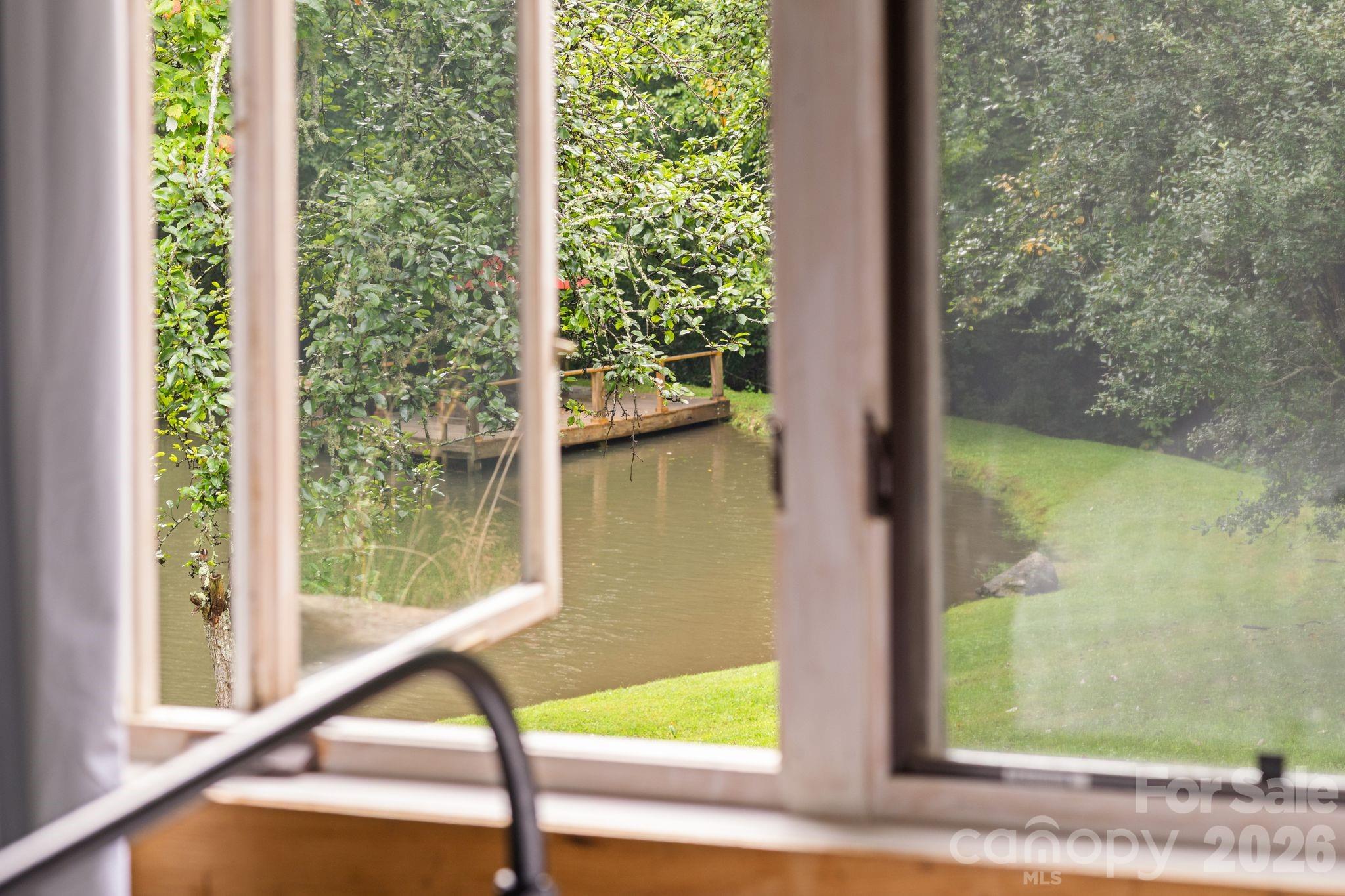 View of pond from bedroom - 1061 Indian Trail Road, Mars Hill