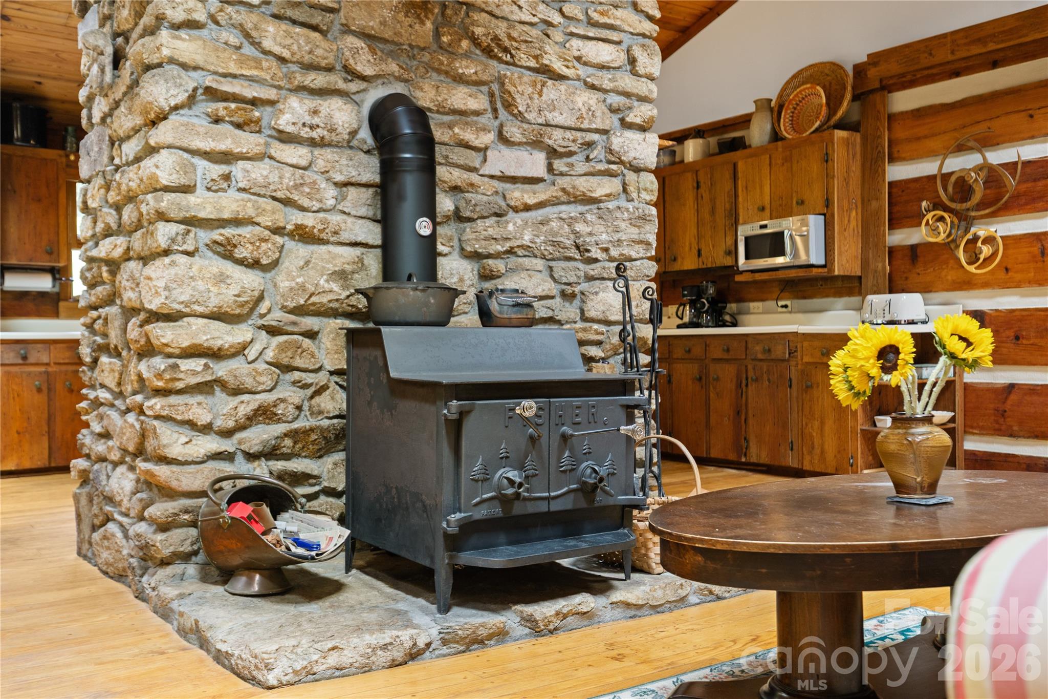 Wood burning stove in main house - 1061 Indian Trail Road, Mars Hill