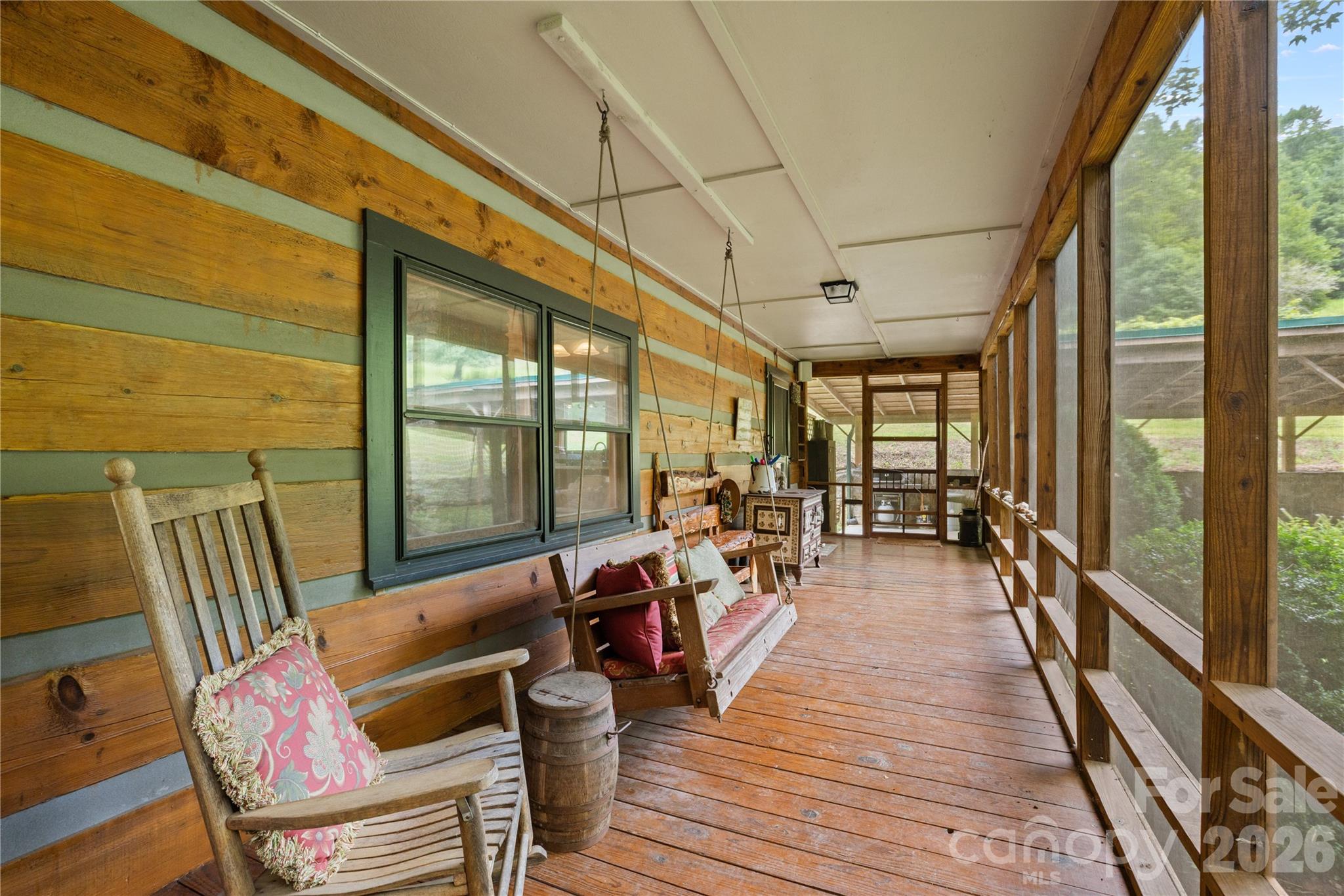 Screened in wrap around porch at the main house - 1061 Indian Trail Road, Mars Hill